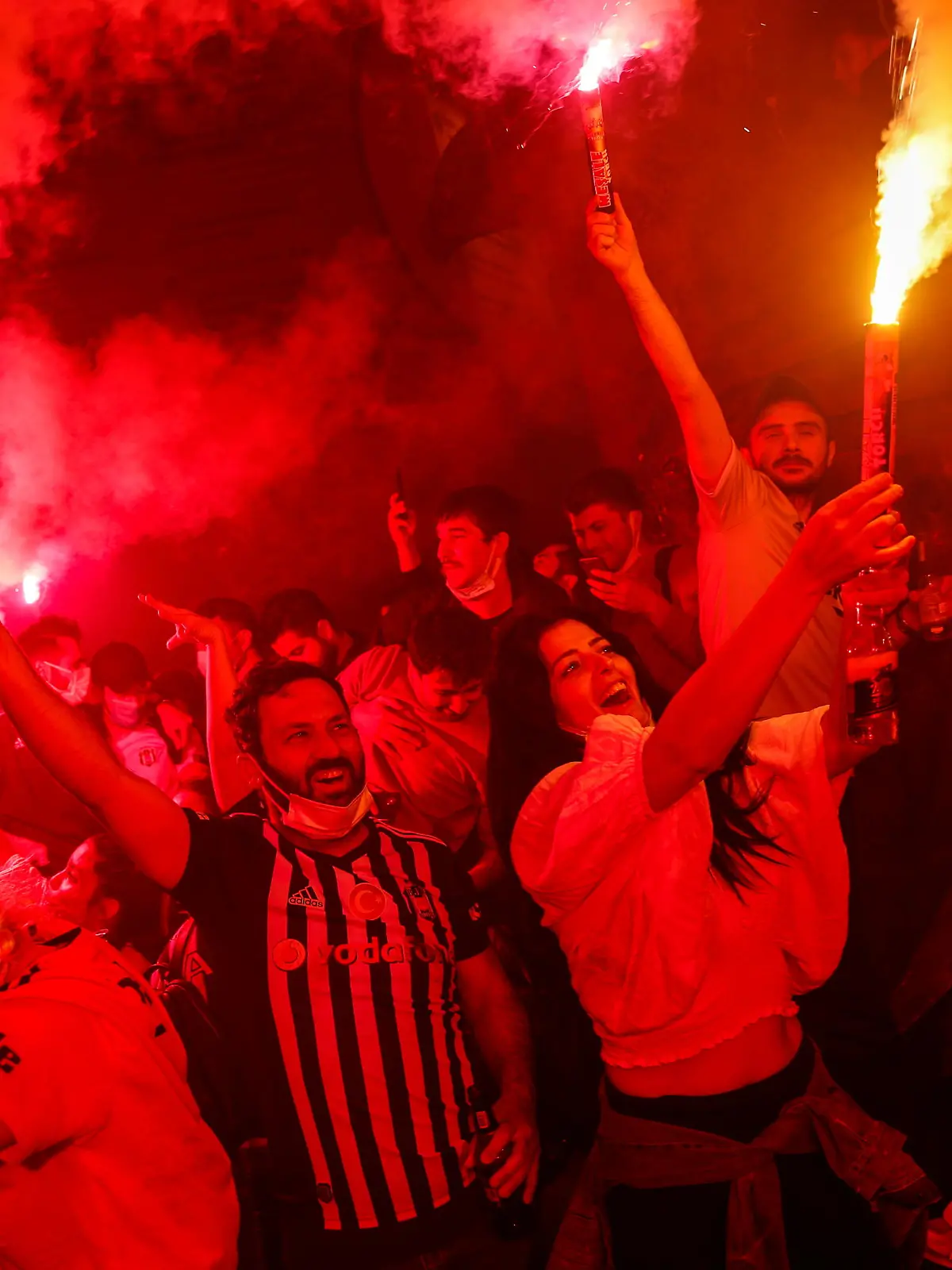 Soccer Football - Super Lig - Besiktas fans celebrate winning the Turkish Super Lig - Istanbul, Turkey May 16, 2021 Besiktas fans celebrate winning the Turkish Super Lig title in their neighbourhood REUTERS/Kemal Aslan