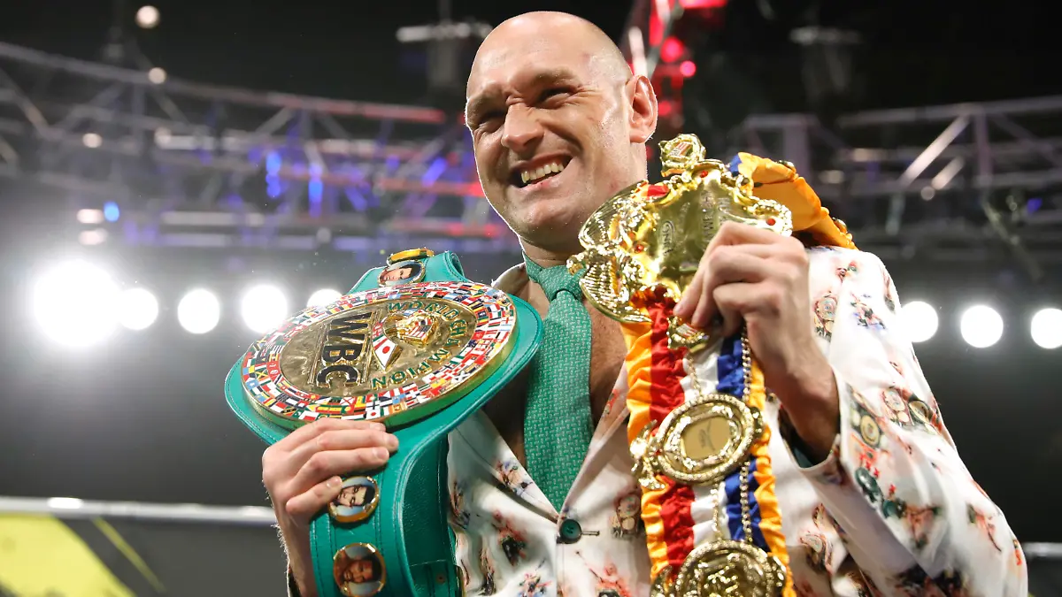 Boxing - Deontay Wilder v Tyson Fury - WBC Heavyweight Title - The Grand Garden Arena at MGM Grand, Las Vegas, United States - February 22, 2020 Tyson Fury poses with his belts during a press conference after the fight REUTERS/Steve Marcus