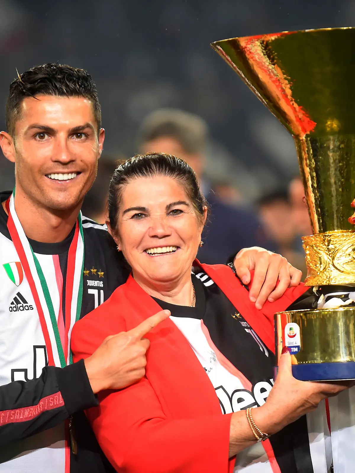 FILE PHOTO: Soccer Football - Serie A - Juventus v Atalanta - Allianz Stadium, Turin, Italy - May 19, 2019   Juventus' Cristiano Ronaldo poses with his mother Maria Dolores dos Santos Aveiro as he celebrates winning Serie A with the trophy   REUTERS/Massimo Pinca/File Photo