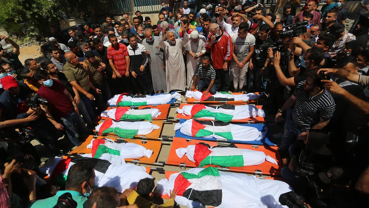 May 15, 2021, Gaza city, Gaza Strip, Palestinian Territory: Palestinians take part in the funeral of the Abu Hatab family in Gaza City on May 15, 2021, a family of 10 who were killed early in an Israeli air strike on the western Gaza Strip. - Eight children and two women, all belonging to the Abu Hatab family, were killed in the three-storey building in Shati refugee camp that collapsed following an Israeli strike, medical sources said Gaza city Palestinian Territory - ZUMAap3_ 20210515_zaf_ap3_038 Copyright: xAshrafxAmrax