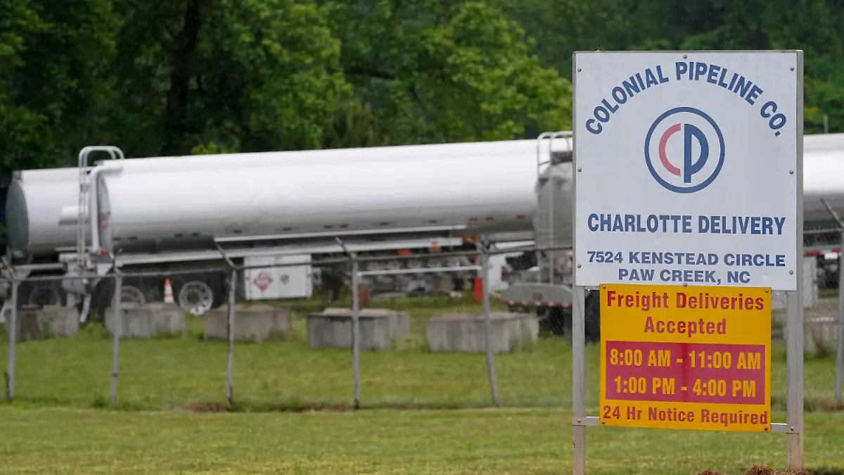 Tanker trucks are parked near the entrance of Colonial Pipeline Company Wednesday, May 12, 2021, in Charlotte, N.C.  Several gas stations in the Southeast reported running out of fuel, primarily because of what analysts say is unwarranted panic-buying among drivers, as the shutdown of a major pipeline by hackers entered its fifth day.  (AP Photo/Chris Carlson)