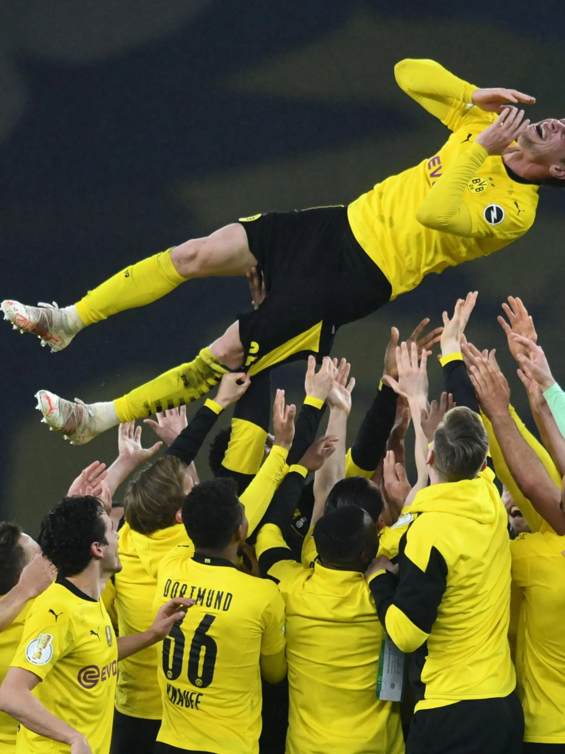 Soccer - DFB Cup - Final - RB Leipzig v Borussia Dortmund - Olympiastadion, Berlin, Germany - May 13, 2021 Borussia Dortmund's Lukasz Piszczek celebrates winning the DFB Cup with teammates Pool via REUTERS/Annegret Hilse DFB regulations prohibit any use of photographs as image sequences and or quasi-video.