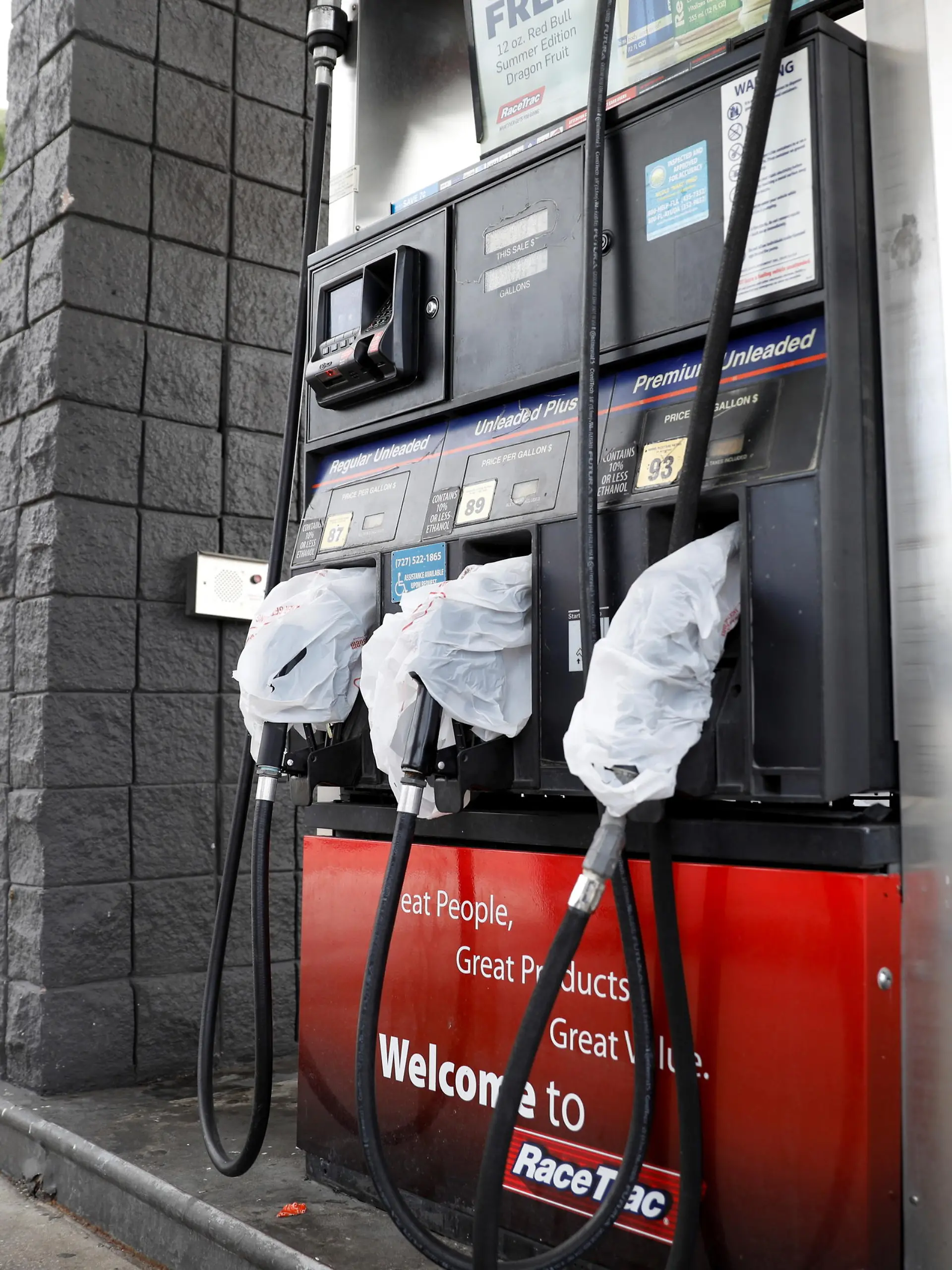Gas pumps are covered with plastic bags at the Race Trac gas station, after a cyberattack crippled the biggest fuel pipeline in the country, run by Colonial Pipeline, in St. Petersburg, Florida, U.S., May 12, 2021. REUTERS/Octavio Jones