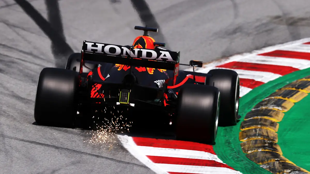 BARCELONA, SPAIN - MAY 07: Sparks fly behind the car of Max Verstappen of the Netherlands driving the (33) Red Bull Racing RB16B Honda on track during practice for the F1 Grand Prix of Spain at Circuit de Barcelona-Catalunya on May 07, 2021 in Barcelona, Spain. (Photo by Lars Baron/Getty Images)