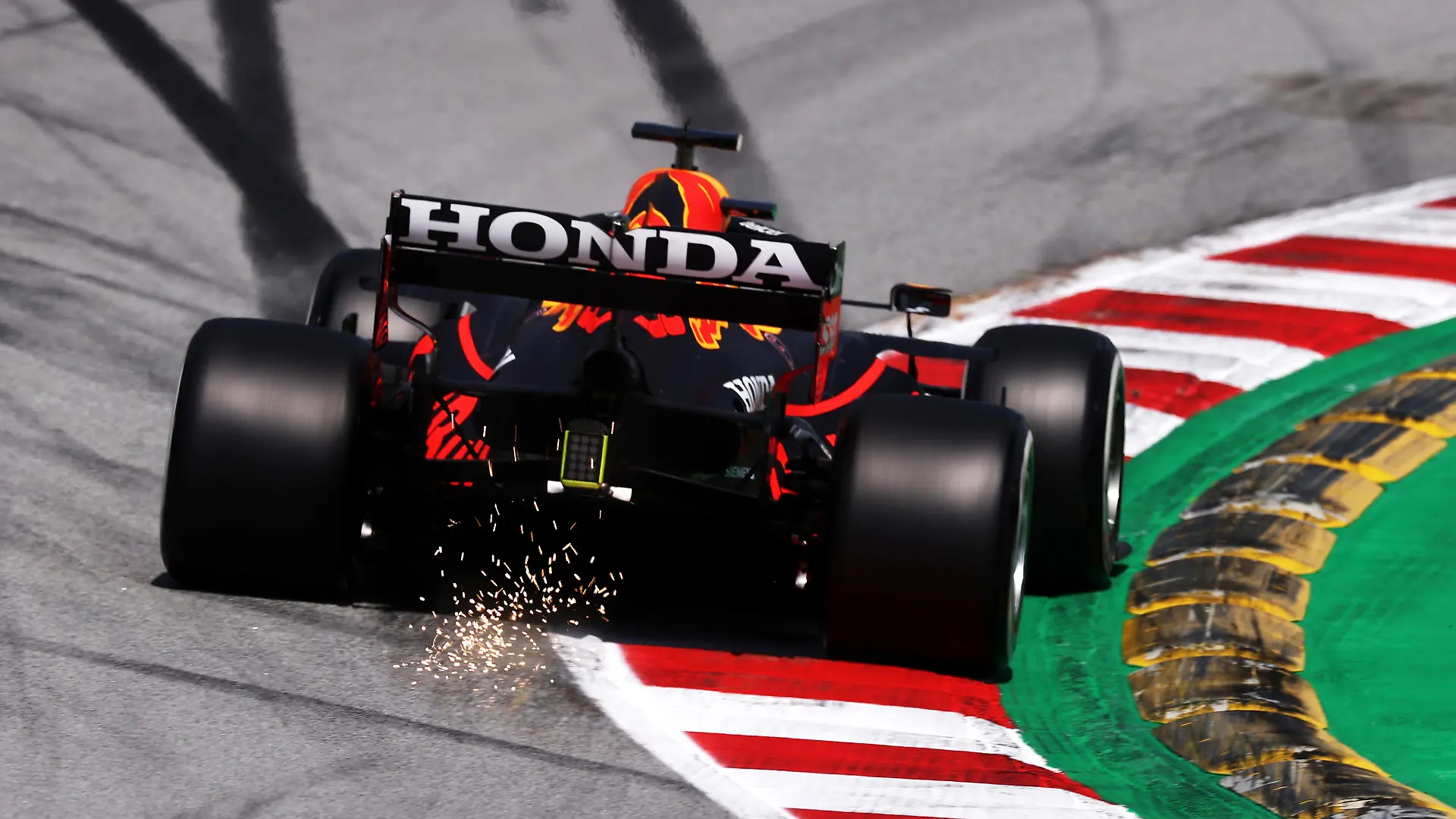 BARCELONA, SPAIN - MAY 07: Sparks fly behind the car of Max Verstappen of the Netherlands driving the (33) Red Bull Racing RB16B Honda on track during practice for the F1 Grand Prix of Spain at Circuit de Barcelona-Catalunya on May 07, 2021 in Barcelona, Spain. (Photo by Lars Baron/Getty Images)
