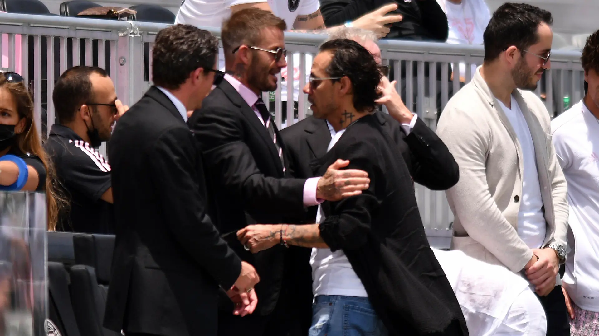 David Beckham, center left, owner and president of soccer operations for Inter Miami, greets artist Marc Anthony, center right, before an MLS soccer match between Inter Miami and Atlanta United, Sunday, May 9, 2021, in Fort Lauderdale, Fla. (AP Photo/Jim Rassol)