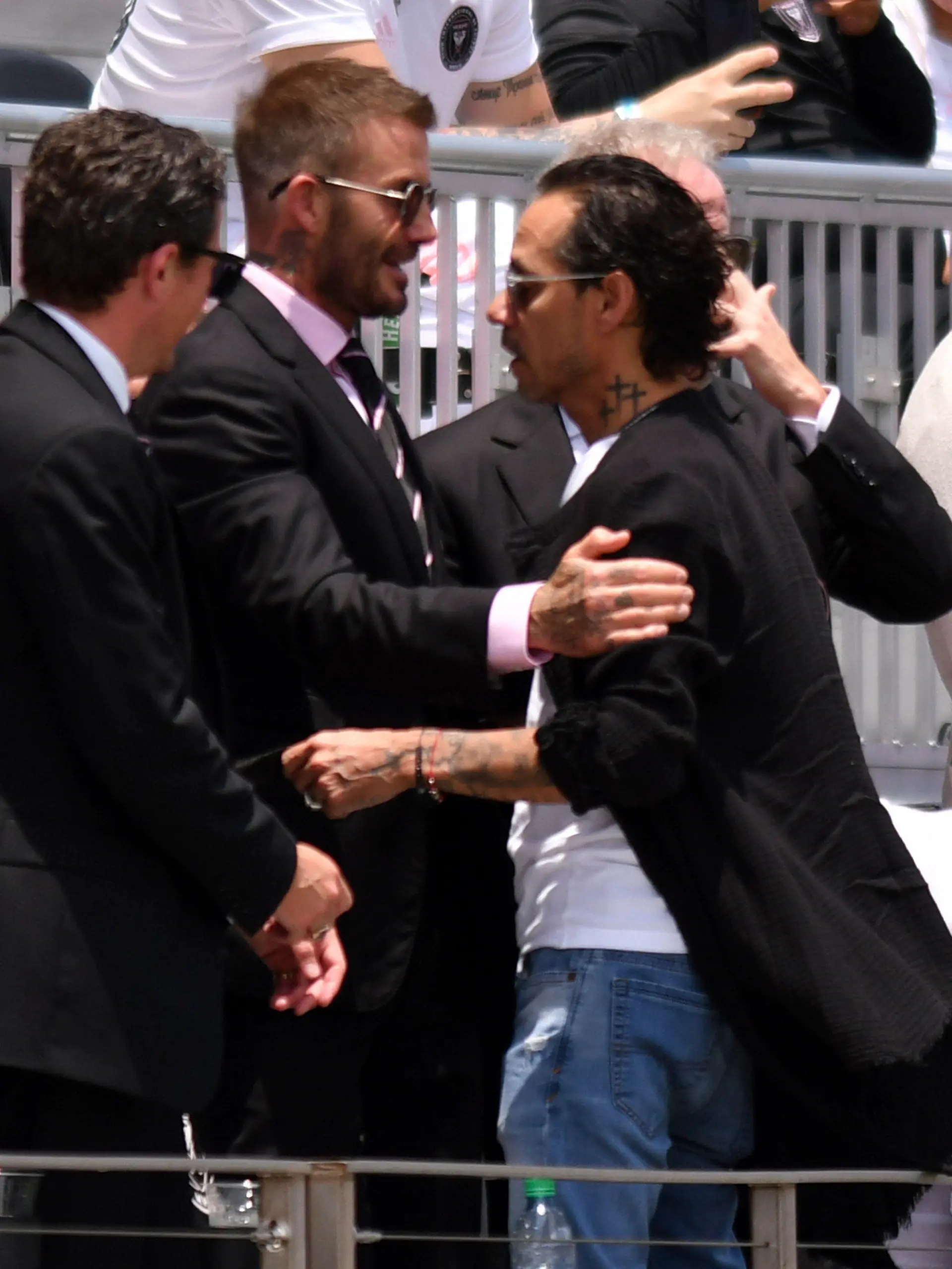 David Beckham, center left, owner and president of soccer operations for Inter Miami, greets artist Marc Anthony, center right, before an MLS soccer match between Inter Miami and Atlanta United, Sunday, May 9, 2021, in Fort Lauderdale, Fla. (AP Photo/Jim Rassol)