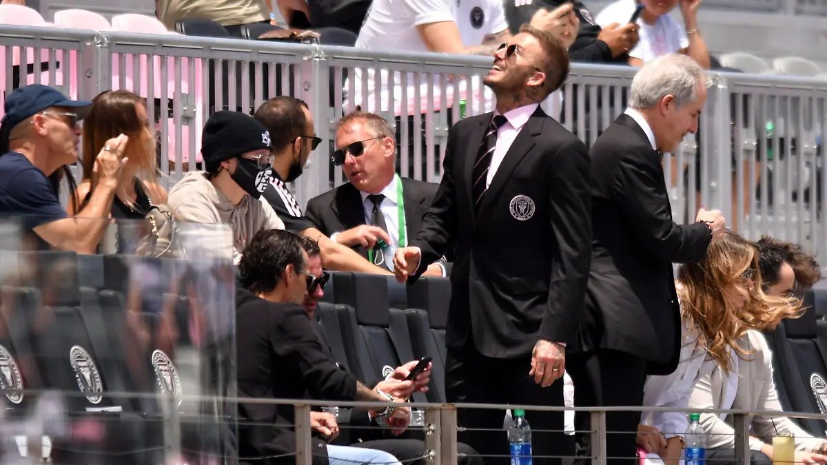 David Beckham, center right, owner and president of soccer operations for Inter Miami, greets friends before an MLS soccer match between Inter Miami and Atlanta United, Sunday, May 9, 2021, in Fort Lauderdale, Fla. (AP Photo/Jim Rassol)