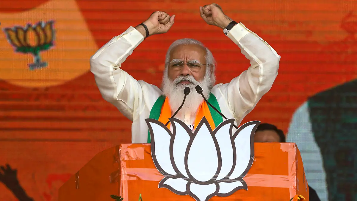 FILE - In this March 7, 2021, file photo, Indian Prime Minister Narendra Modi addresses a public rally ahead of West Bengal state elections in Kolkata, India. As coronavirus deaths mount and a vaccine rollout falters badly, the crisis has badly dented Modi’s carefully cultivated image as an able technocrat. (AP Photo/Bikas Das, File)