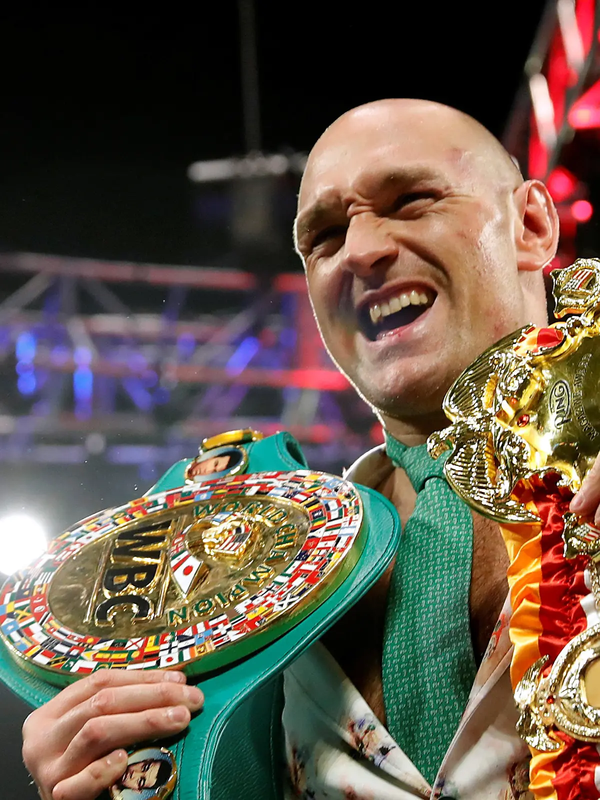 FILE PHOTO: Boxing - Deontay Wilder v Tyson Fury - WBC Heavyweight Title - The Grand Garden Arena at MGM Grand, Las Vegas, United States - February 22, 2020 Tyson Fury poses with his belts during a press conference after the fight REUTERS/Steve Marcus/File Photo