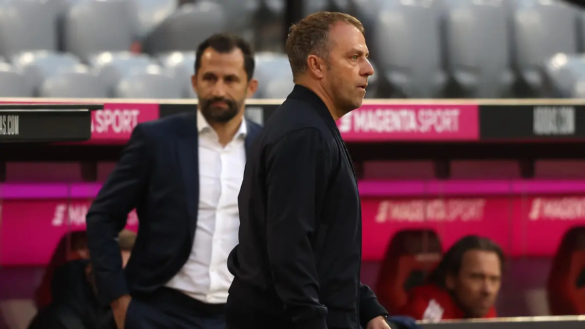 MUNICH, GERMANY - MAY 08: Hans-Dieter Flick, head coach of FC Bayern München looks on next to sporting director Hasan Salihamidzic during the Bundesliga match between FC Bayern Muenchen and Borussia Moenchengladbach at Allianz Arena on May 08, 2021 in Munich, Germany. (Photo by Alexander Hassenstein/Getty Images)