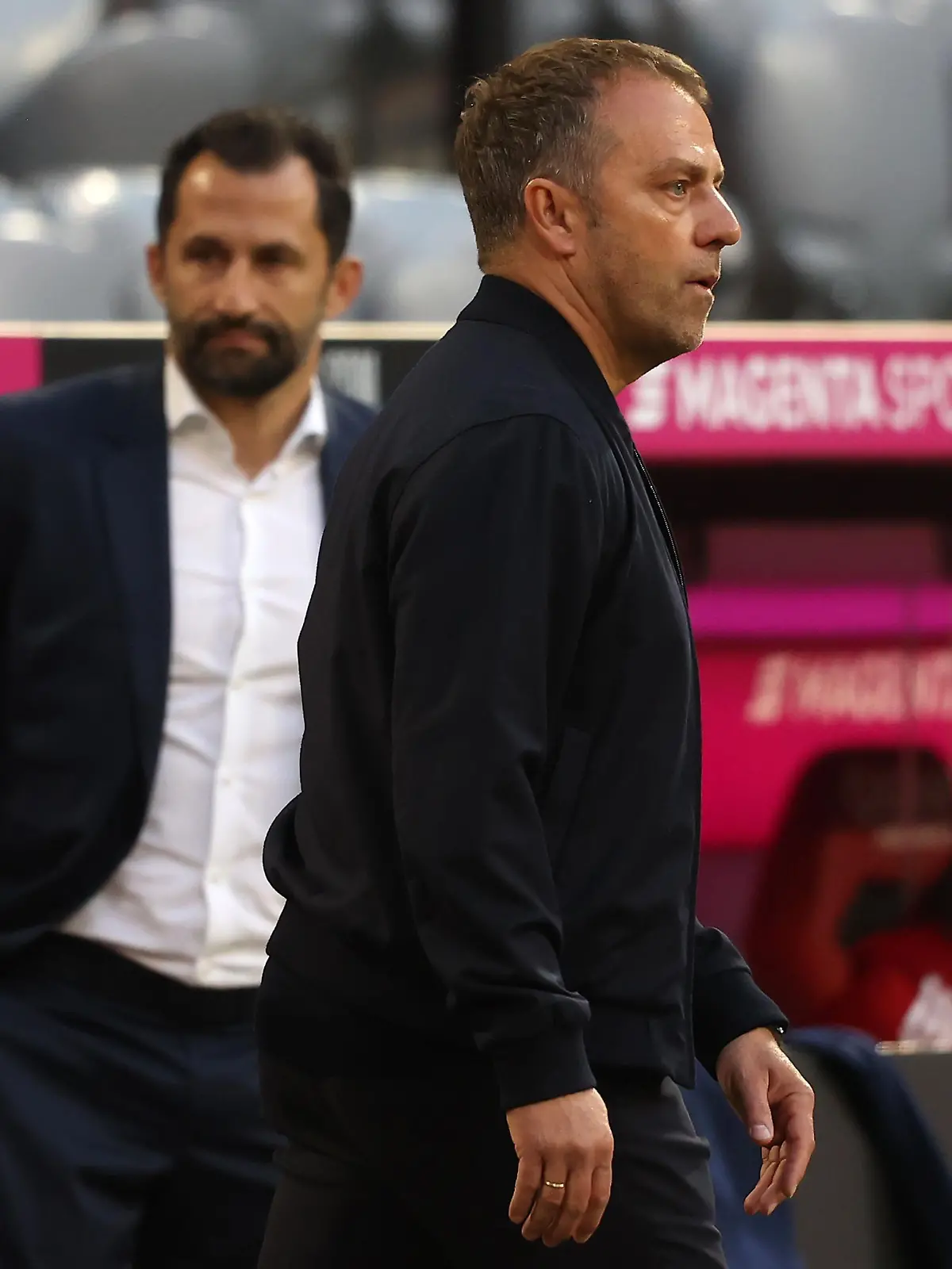 MUNICH, GERMANY - MAY 08: Hans-Dieter Flick, head coach of FC Bayern München looks on next to sporting director Hasan Salihamidzic during the Bundesliga match between FC Bayern Muenchen and Borussia Moenchengladbach at Allianz Arena on May 08, 2021 in Munich, Germany. (Photo by Alexander Hassenstein/Getty Images)