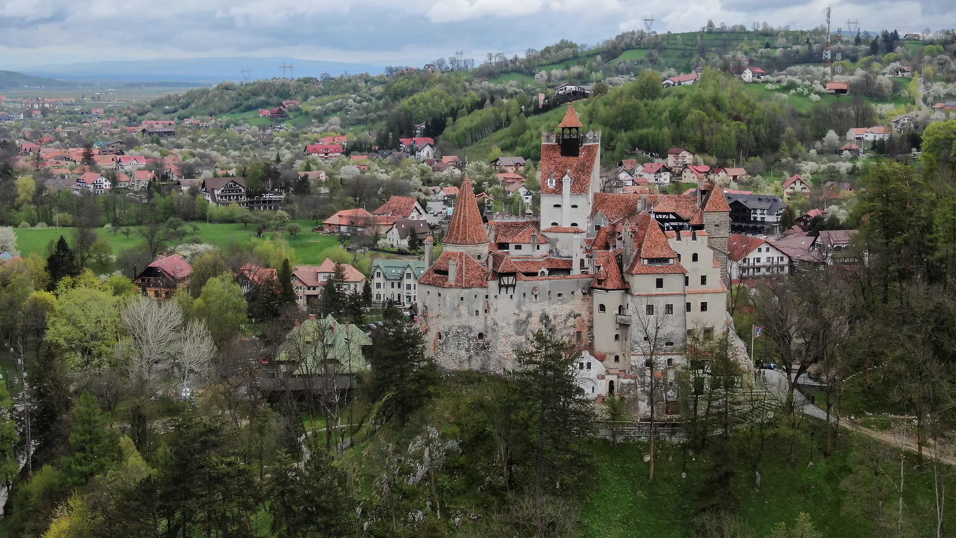 Bran Castle towers above Bran commune, in Brasov county, Romania, May 8, 2021. Picture taken with a drone. Inquam Photos/George Calin via REUTERS ATTENTION EDITORS - THIS IMAGE WAS PROVIDED BY A THIRD PARTY. ROMANIA OUT. NO COMMERCIAL OR EDITORIAL SALES IN ROMANIA