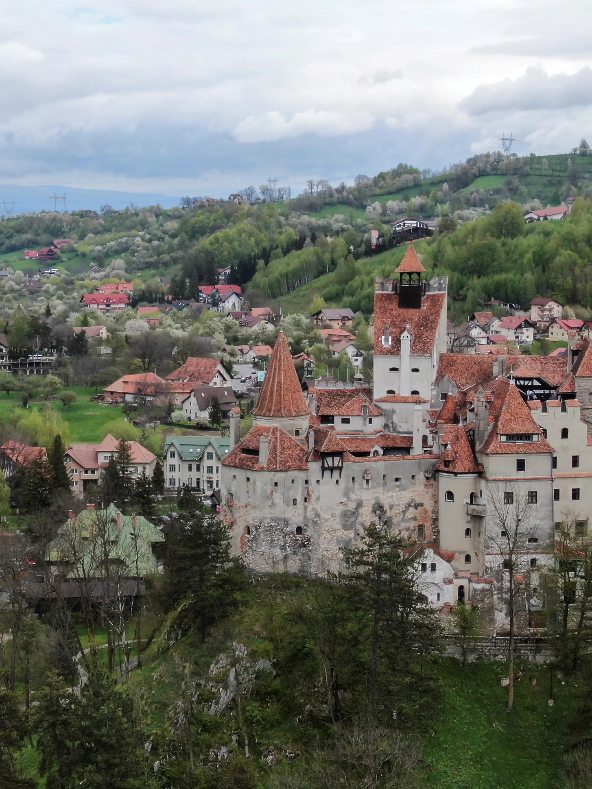 Bran Castle towers above Bran commune, in Brasov county, Romania, May 8, 2021. Picture taken with a drone. Inquam Photos/George Calin via REUTERS ATTENTION EDITORS - THIS IMAGE WAS PROVIDED BY A THIRD PARTY. ROMANIA OUT. NO COMMERCIAL OR EDITORIAL SALES IN ROMANIA