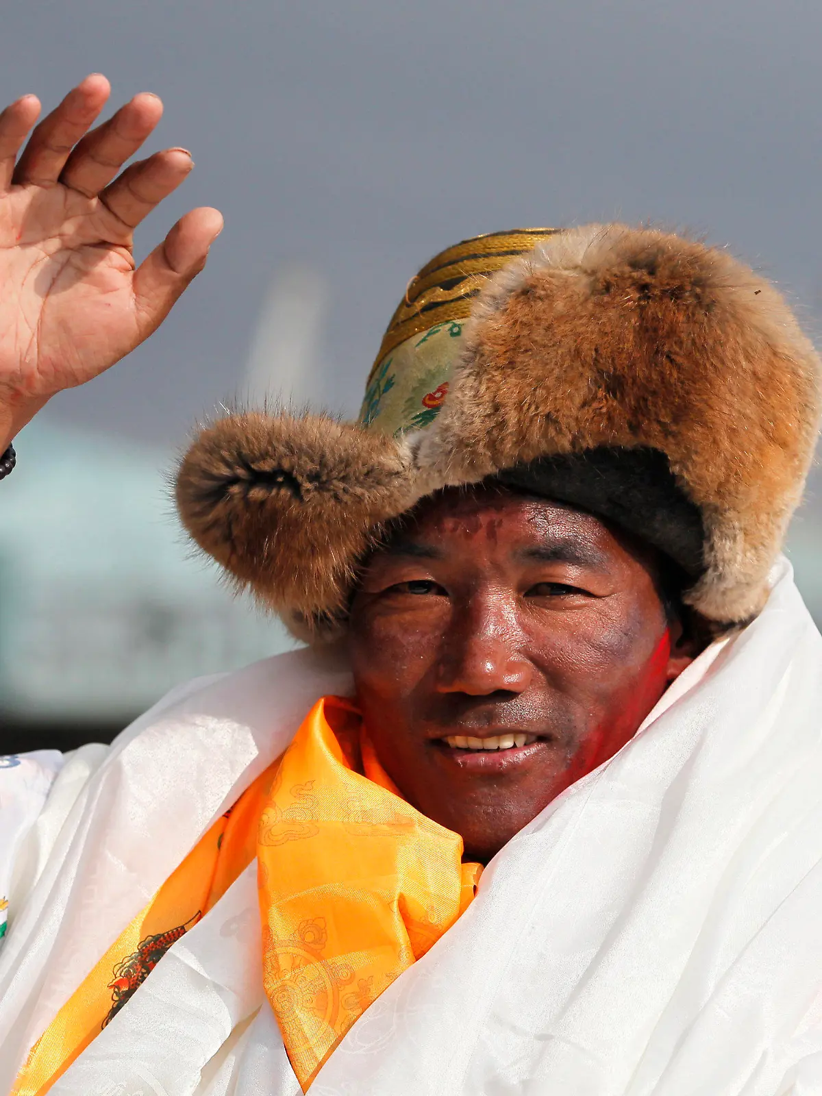 FILE - In this May 20, 2018, file photo, Nepalese veteran Sherpa guide, Kami Rita waves as he arrives in Kathmandu, Nepal. Rita, 51, an ace Sherpa guide scaled Mount Everest Friday for the 25th time breaking his own record for the most successful ascents of the world’s highest peak.  (AP Photo/Niranjan Shrestha, File)