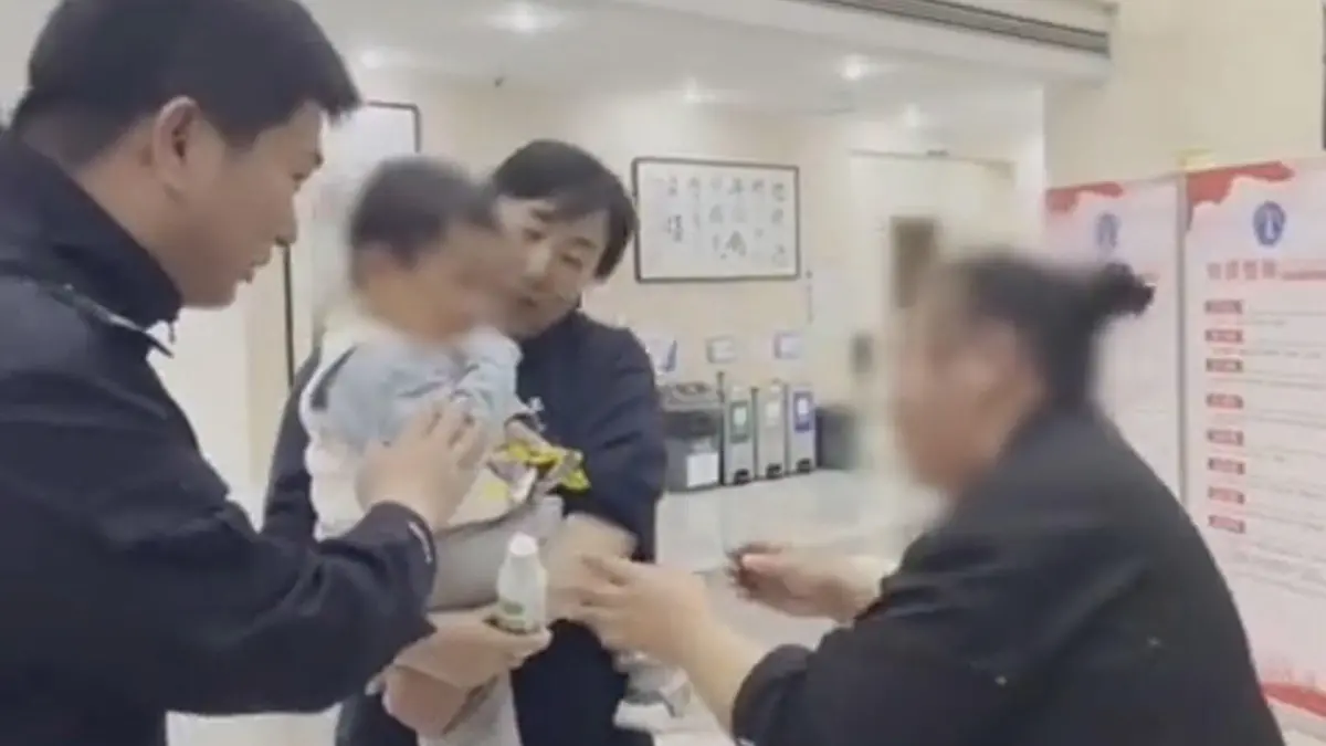 The boy returned to his family after his father allegedly sold him and used the money to travel with his new wife, in Zhejiang, China. (Wu Xing Public Security/AsiaWire)