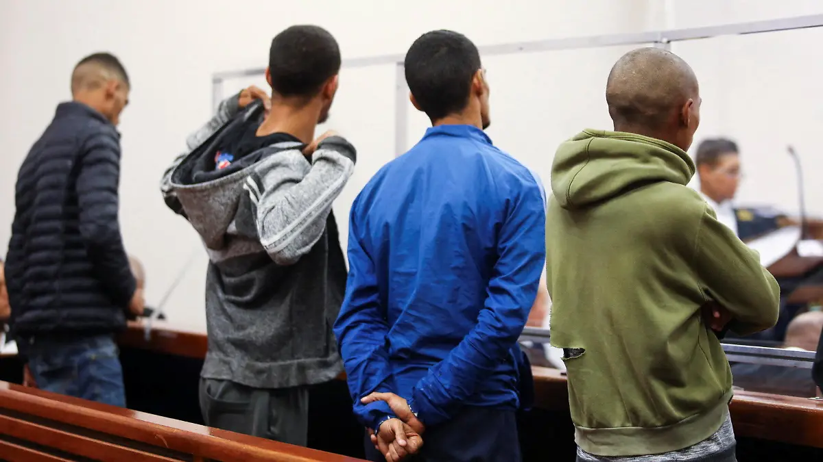 Ishaan Fisher, Jason Adonis, Melvin Geunantin, Van Roy Petersen, four of five suspects appear in court on charges of the aggravated robbery of Nick Frischke, a German tourist who disappeared in Cape Town, South Africa March 6, 2023. REUTERS/Shelley Christians.