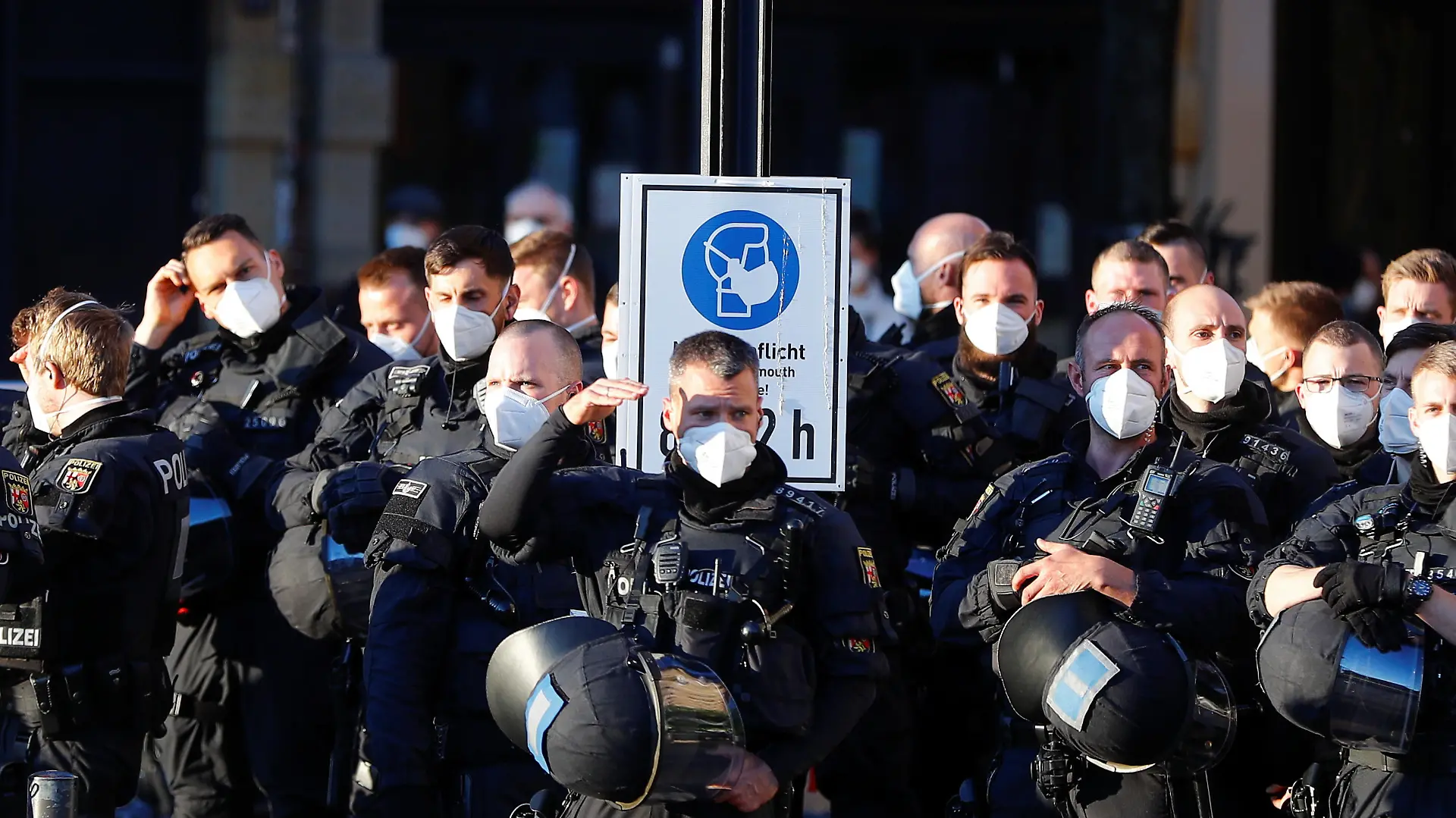 Police officers observe as left-wing activists (Antifa) gather to celebrate the 100th anniversary of Antifa in Frankfurt, Germany, May 7, 2021. REUTERS/Kai Pfaffenbach