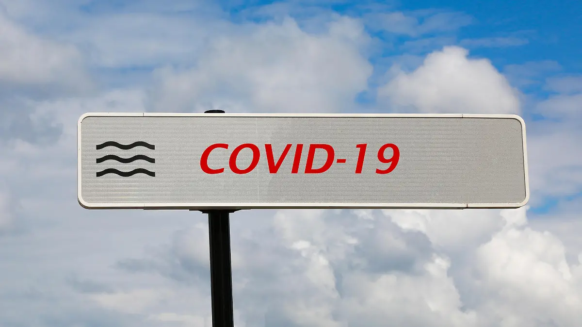 Covid-19-Schild mit Wellensymbol