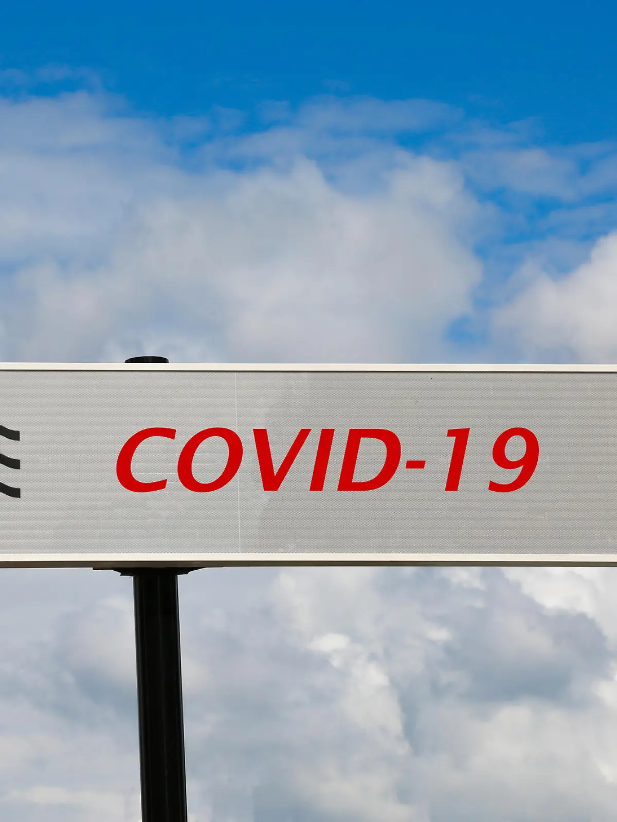 Covid-19-Schild mit Wellensymbol