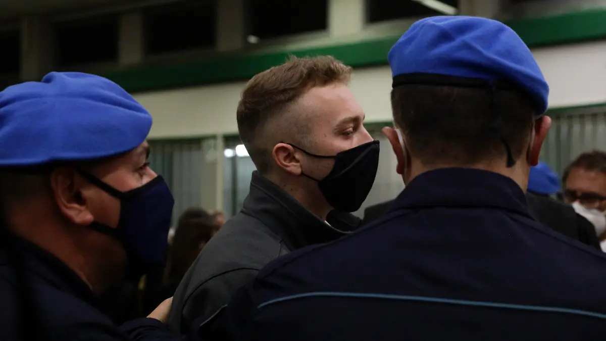 Finnegan Lee Elder leaves after listening to the verdict in the trial for the slaying of an Italian plainclothes police officer in summer 2019, in Rome, Wednesday, May 5, 2021. A jury in Rome on Wednesday convicted two American friends in the 2019 slaying of a police officer in a drug sting gone awry, sentencing them to life in prison. The jury deliberated more than 12 hours before delivering the verdicts against Finnegan Lee Elder, 21, and Gabriel Natale Hjorth, 20, handing them Italy's stiffest sentence. (AP Photo/Gregorio Borgia)