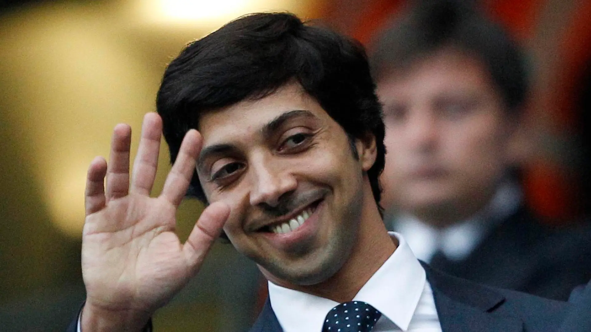 Manchester City's owner Sheik Mansour bin Zayed Al Nahyan waves ahead of their English Premier League soccer match against Liverpool at the City of Manchester stadium in Manchester, in this August 23, 2010 file picture. Clubs supported by benefactors sometimes end up paying more for players than total club turnover. Manchester City spent 107 percent of revenue on wages last season. To end lavish spending, UEFA has devised new regulations to force clubs to pay out no more than they earn. The new rules, which UEFA calls Financial Fair Play (FFP), begin August 2011 with the start of the European season. Clubs will have two years to begin balancing their books. If they don't meet FFP targets from the 2013/14 season, UEFA says it will expel them from club soccer's premier Champions League competition. That would lose a club tens of millions of euros in television revenue plus the global exposure that helps generate millions more in merchandise sales.    To match Special Report SOCCER-FAIRPLAY/     REUTERS/Darren Staples/Files   (BRITAIN - Tags: SPORT SOCCER BUSINESS) NO ONLINE/INTERNET USAGE WITHOUT A LICENCE FROM THE FOOTBALL DATA CO LTD. FOR LICENCE ENQUIRIES PLEASE TELEPHONE ++44 (0) 207 864 9000