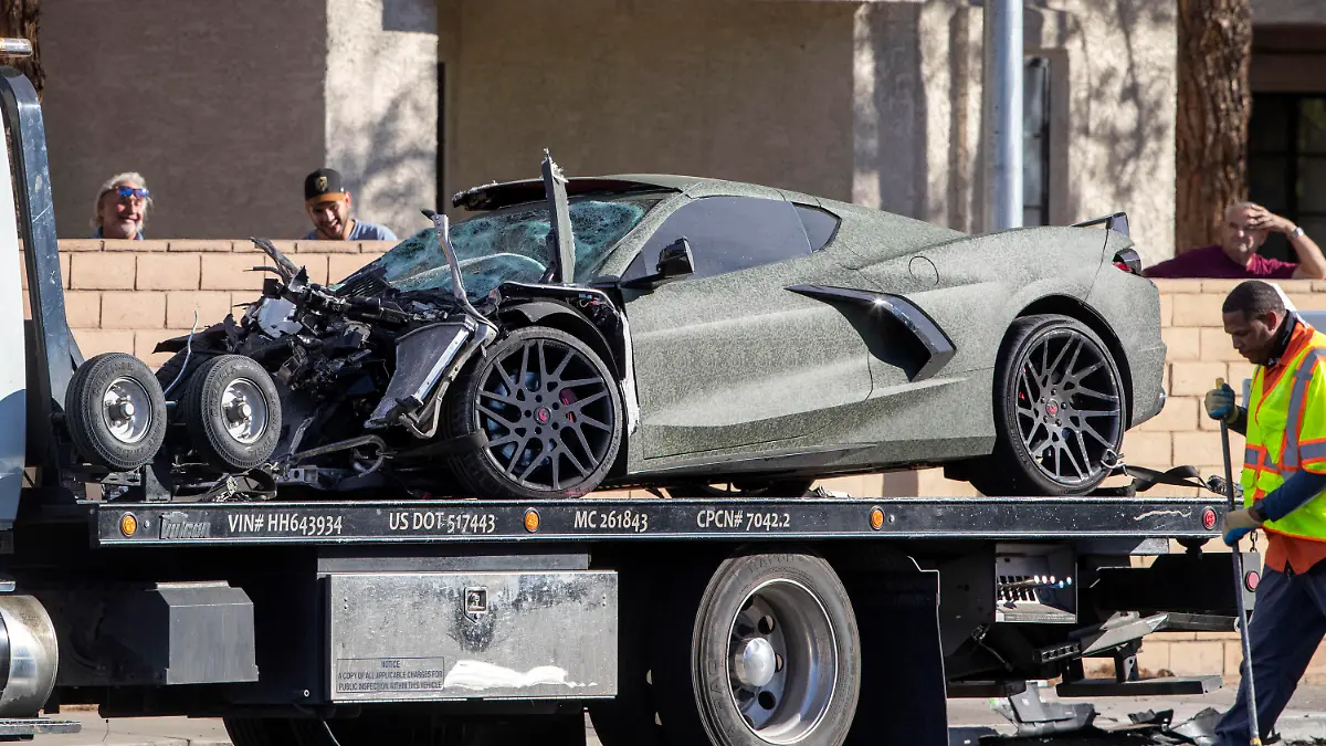FILE - A Chevrolet Corvette owned by Las Vegas Raiders wide receiver Henry Ruggs III is shown on a flatbed truck after a fatal crash on South Rainbow Boulevard between Tropicana Avenue and Flamingo Road in Las Vegas Tuesday, Nov. 2, 2021. Ruggs will admit driving drunk at speeds up to 156 mph and causing a fiery crash that killed a woman, in a plea deal that is expected to send the one-time football star to state prison for at least three years. (Steve Marcus/Las Vegas Sun via AP,File)