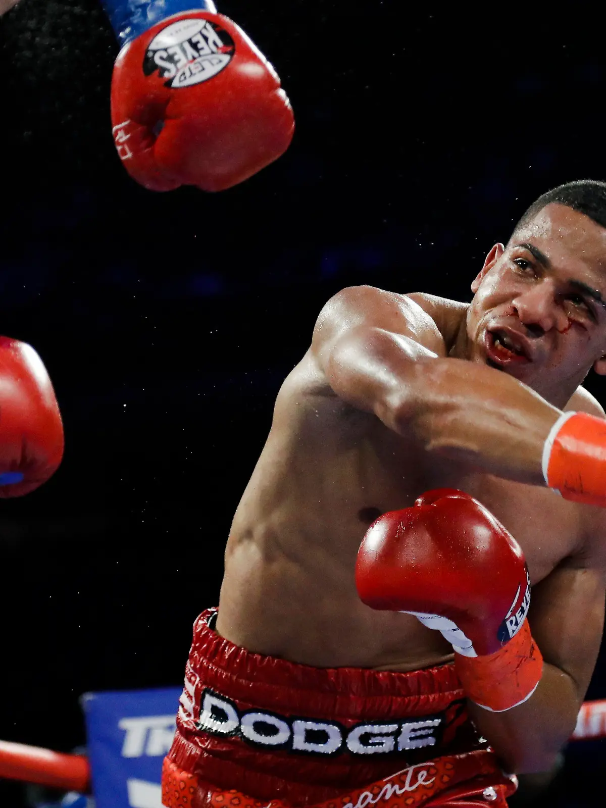 FiLE - In this April 20, 2019 file photo, Puerto Rico's Felix Verdejo, right, punches Costa Rica's Bryan Vazquez during the fifth round of a lightweight boxing match in New York. Verdejo has turned himself in to federal agents on Saturday, May 1, 2021, just hours after authorities identified the body of his 27-year-old lover Keishla Rodríguez in a lagoon in the U.S. territory, a couple of days after she was reported missing. (AP Photo/Frank Franklin II, File)