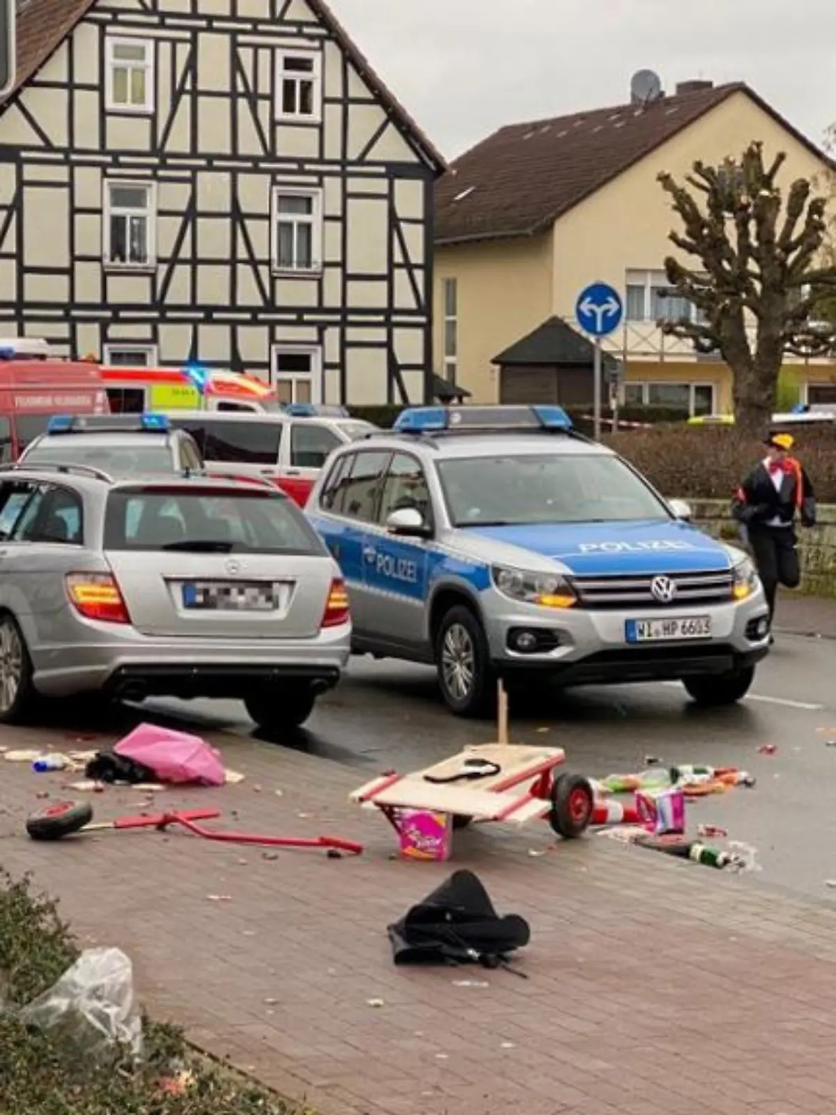 People react at the scene after a car ploughed into a carnival parade injuring several people in Volkmarsen, Germany February 24, 2020. ATTENTION:NUMBER PLATE WAS PIXELATED FROM SOURCE.     Elmar Schulten/Waldeckische Landeszeitung via REUTERS.      NO RESALES. NO ARCHIVES