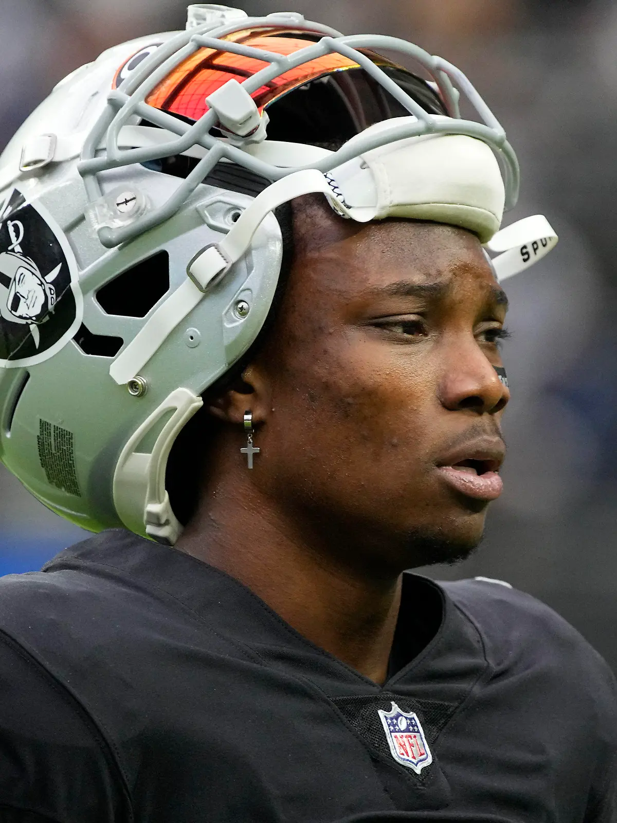 FILE - Las Vegas Raiders wide receiver Henry Ruggs III walks on the field before an NFL football game against the Chicago Bears, Oct. 10, 2021, in Las Vegas. Police in Las Vegas said Ruggs is facing a driving under the influence charge after a fiery vehicle crash early Tuesday, Nov. 2, 2021, that left a woman dead and Ruggs and his female passenger injured. (AP Photo/Rick Scuteri, File)