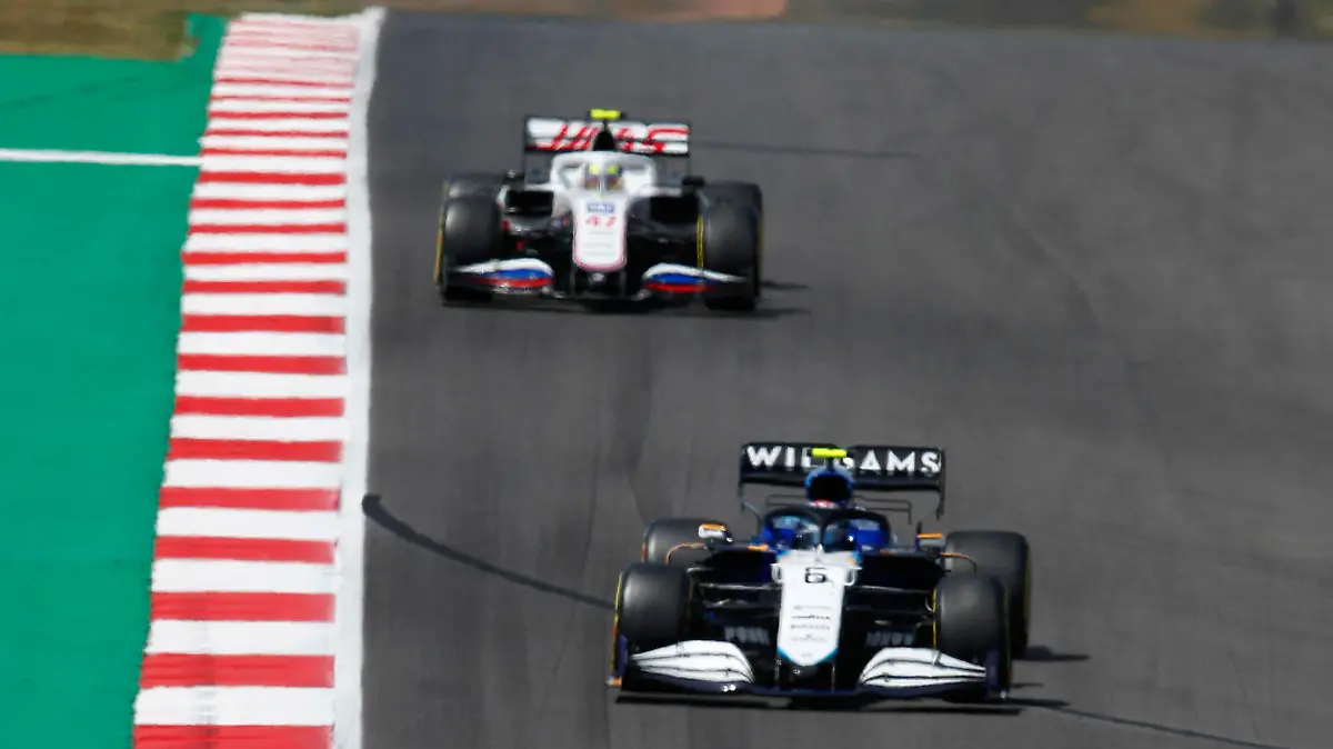Formula 1 2021: Portuguese GP ALGARVE INTERNATIONAL CIRCUIT, PORTUGAL - MAY 02: Lance Stroll, Aston Martin AMR21, leads Nicholas Latifi, Williams FW43B, and Mick Schumacher, Haas VF-21 during the Portuguese GP at Algarve International Circuit on Sunday May 02, 2021 in Portimao, Portugal. Photo by Zak Mauger / LAT Images Images PUBLICATIONxINxGERxSUIxAUTxHUNxONLY GP2103_140957_54I1712