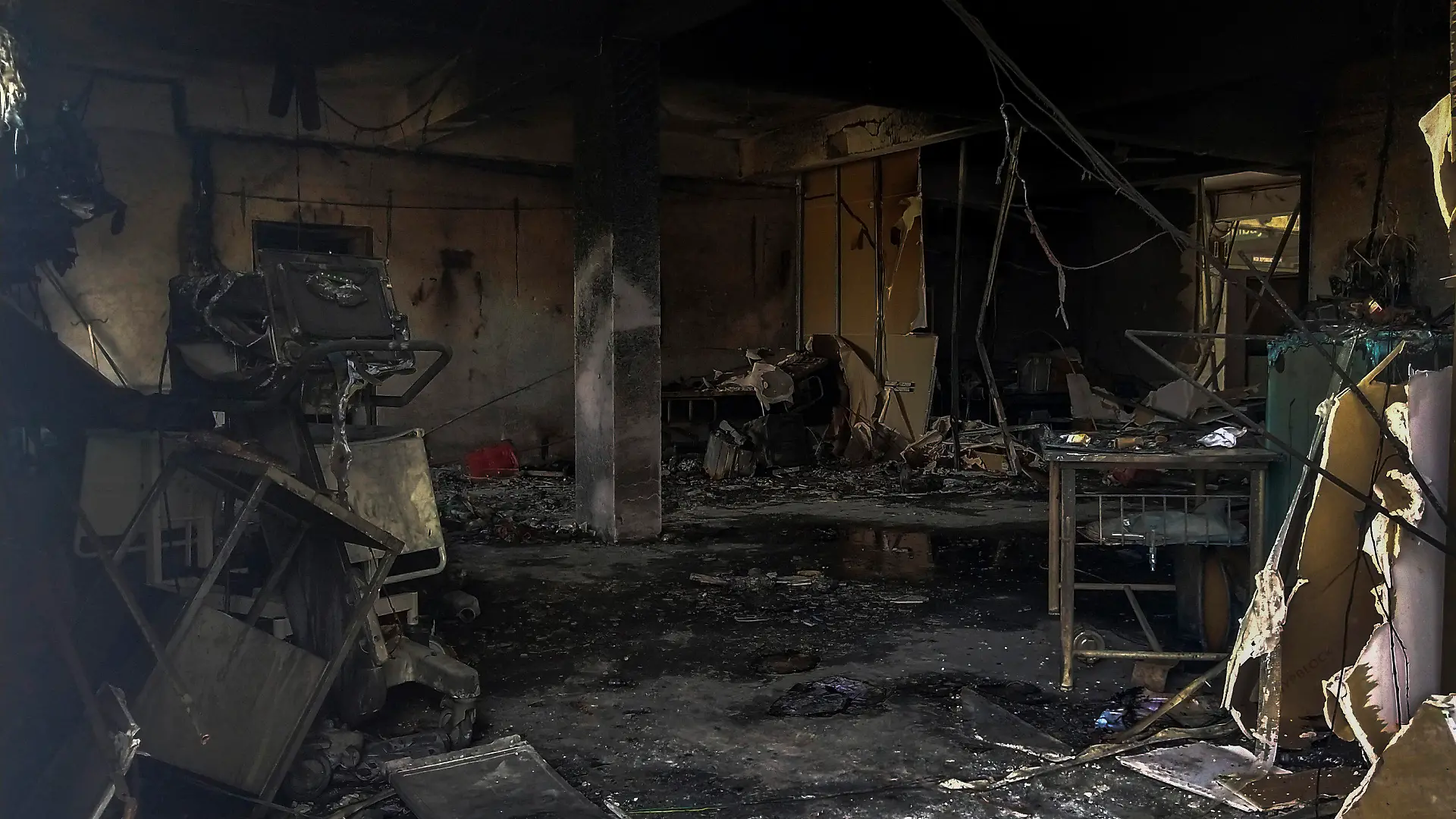 Charred furniture and other items are seen after a deadly fire at the Welfare Hospital in Bharuch, western India, Saturday, May 1, 2021. The fire in a COVID-19 ward of the hospital killed multiple patients early Saturday, as the country grappling with the worst outbreak yet steps up a vaccination drive for all its adults even though some states say don't have enough jabs. (AP Photo/Viral Rana)