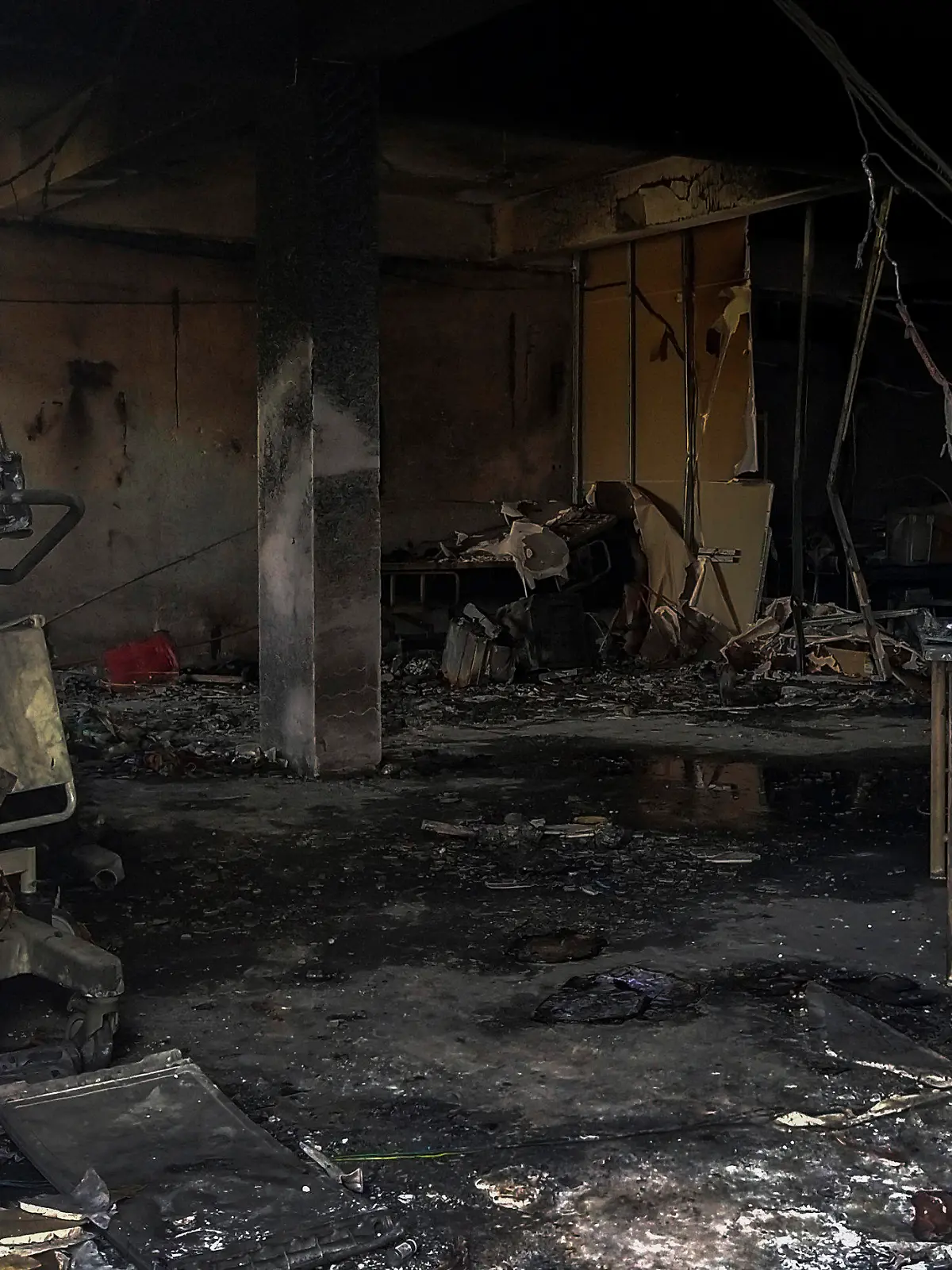 Charred furniture and other items are seen after a deadly fire at the Welfare Hospital in Bharuch, western India, Saturday, May 1, 2021. The fire in a COVID-19 ward of the hospital killed multiple patients early Saturday, as the country grappling with the worst outbreak yet steps up a vaccination drive for all its adults even though some states say don't have enough jabs.  (AP Photo/Viral Rana)