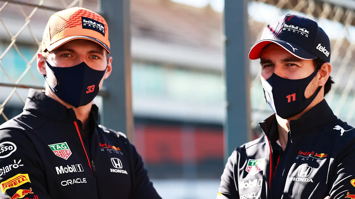 PORTIMAO, PORTUGAL - APRIL 29: Max Verstappen of Netherlands and Red Bull Racing and Sergio Perez of Mexico and Red Bull Racing look on in the Pitlane during previews ahead of the F1 Grand Prix of Portugal at Autodromo Internacional Do Algarve on April 29, 2021 in Portimao, Portugal. (Photo by Mark Thompson/Getty Images)