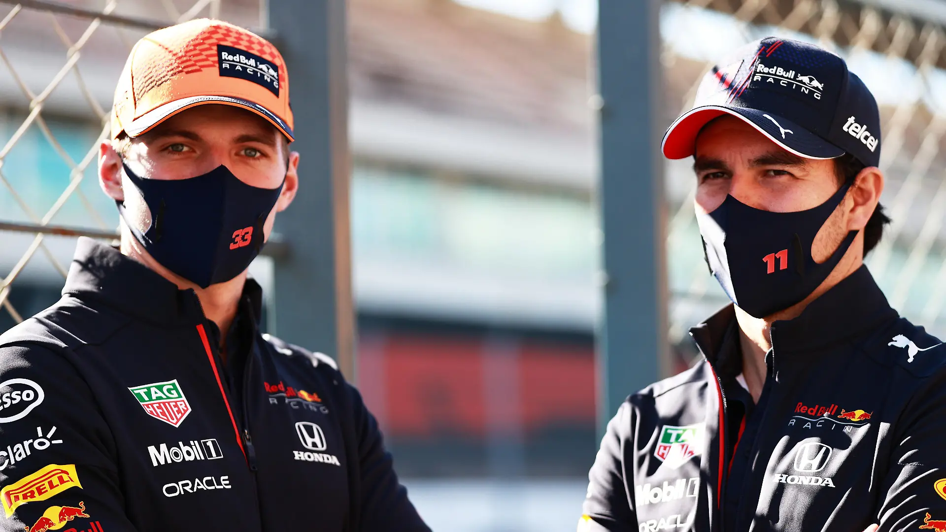 PORTIMAO, PORTUGAL - APRIL 29: Max Verstappen of Netherlands and Red Bull Racing and Sergio Perez of Mexico and Red Bull Racing look on in the Pitlane during previews ahead of the F1 Grand Prix of Portugal at Autodromo Internacional Do Algarve on April 29, 2021 in Portimao, Portugal. (Photo by Mark Thompson/Getty Images)