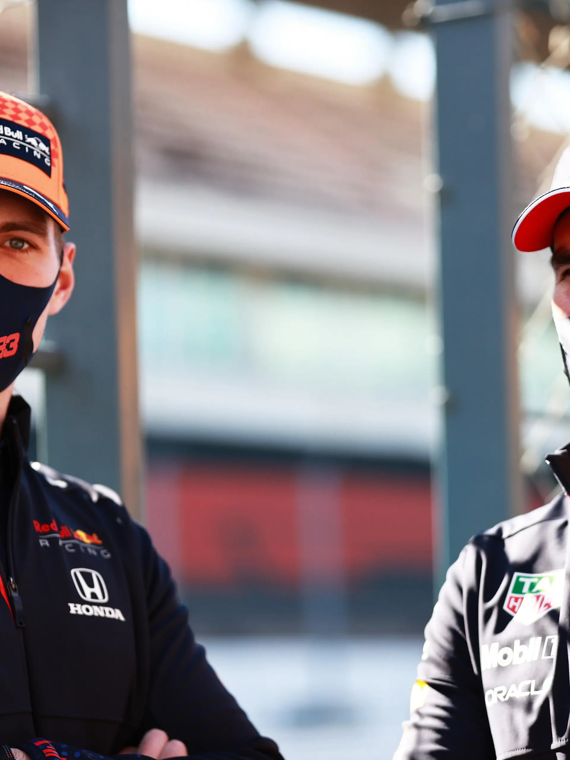 PORTIMAO, PORTUGAL - APRIL 29: Max Verstappen of Netherlands and Red Bull Racing and Sergio Perez of Mexico and Red Bull Racing look on in the Pitlane during previews ahead of the F1 Grand Prix of Portugal at Autodromo Internacional Do Algarve on April 29, 2021 in Portimao, Portugal. (Photo by Mark Thompson/Getty Images)