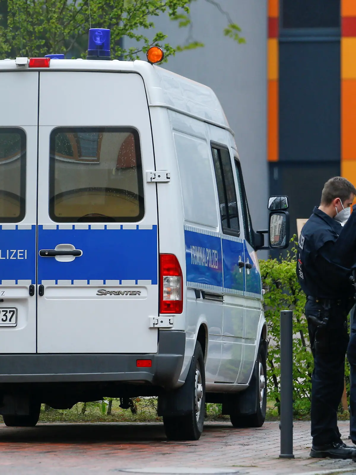 Police officers stand near the Oberlin Clinic, where four people were found dead and another seriously injured, following the arrest of a 51-year-old-woman, in Potsdam, Germany, April 29, 2021. REUTERS/Michele Tantussi