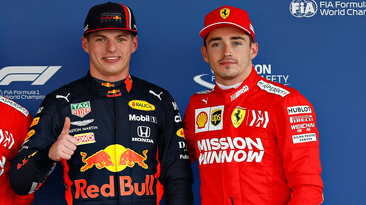 MEXICO CITY, MEXICO - OCTOBER 26: Top three qualifiers Max Verstappen of Netherlands and Red Bull Racing, Charles Leclerc of Monaco and Ferrari and Sebastian Vettel of Germany and Ferrari celebrate in parc ferme during qualifying for the F1 Grand Prix of Mexico at Autodromo Hermanos Rodriguez on October 26, 2019 in Mexico City, Mexico. (Photo by Will Taylor-Medhurst/Getty Images)