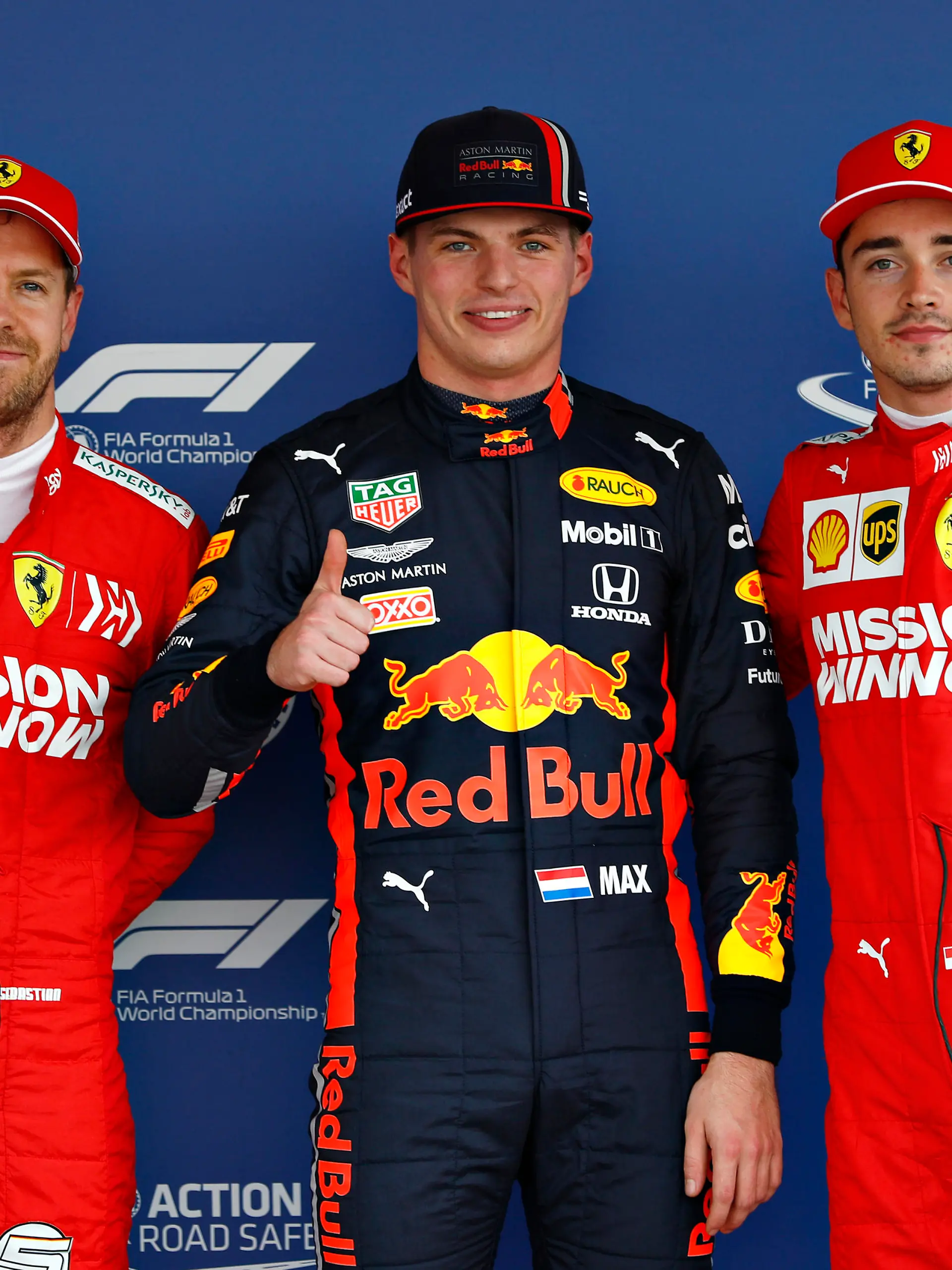MEXICO CITY, MEXICO - OCTOBER 26: Top three qualifiers Max Verstappen of Netherlands and Red Bull Racing, Charles Leclerc of Monaco and Ferrari and Sebastian Vettel of Germany and Ferrari celebrate in parc ferme during qualifying for the F1 Grand Prix of Mexico at Autodromo Hermanos Rodriguez on October 26, 2019 in Mexico City, Mexico. (Photo by Will Taylor-Medhurst/Getty Images)