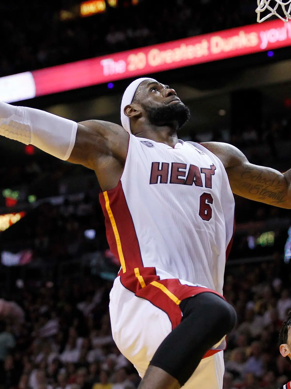 Miami Heat's LeBron James prepares to dunk against the Chicago Bulls in the first half of their NBA basketball game in Miami, Florida April 14, 2013. REUTERS/Andrew Innerarity (UNITED STATES - Tags: SPORT BASKETBALL)