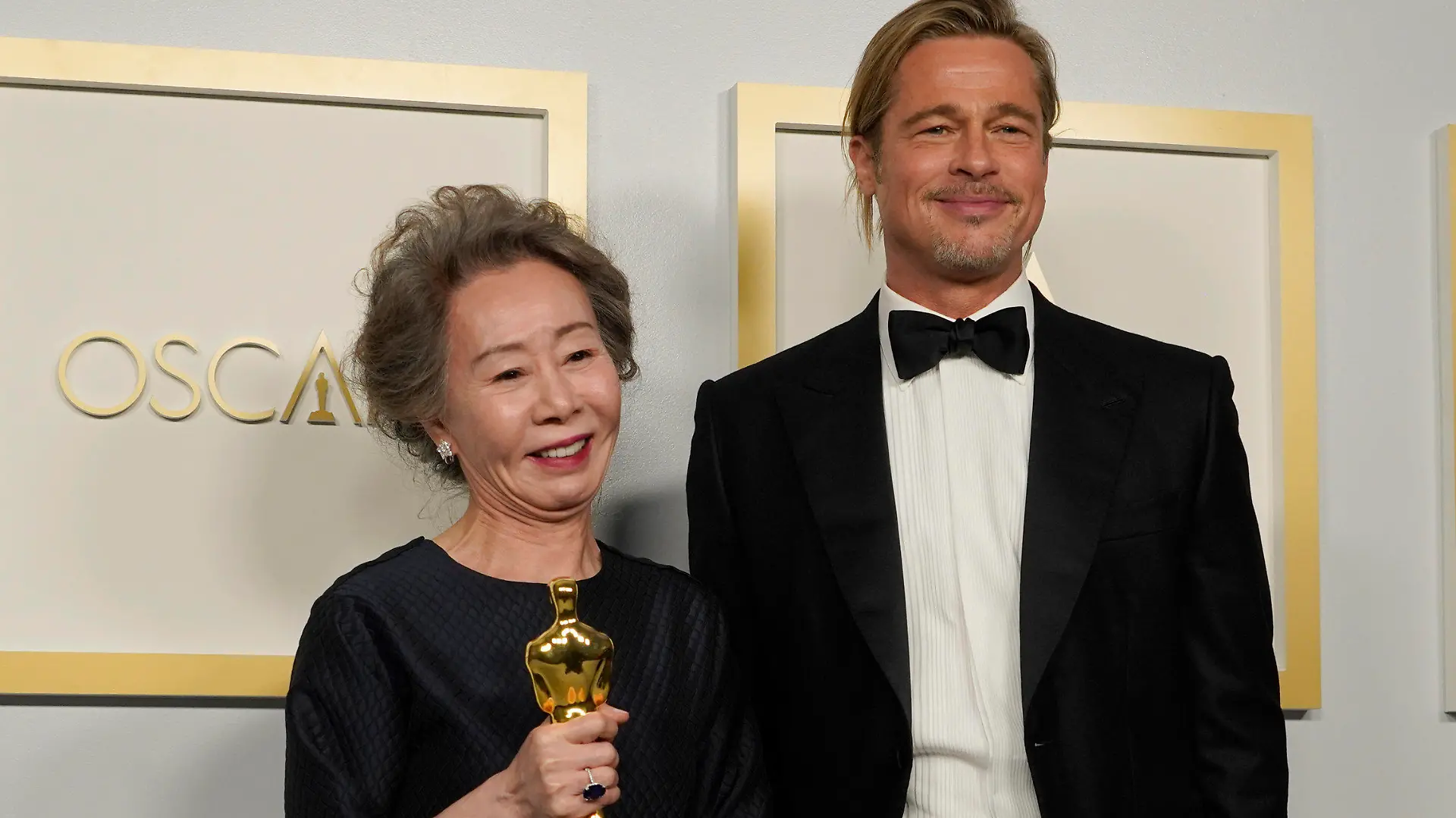 Brad Pitt, right, poses with Yuh-Jung Youn, winner of the award for best actress in a supporting role for "Minari," in the press room at the Oscars on Sunday, April 25, 2021, at Union Station in Los Angeles. (AP Photo/Chris Pizzello, Pool)