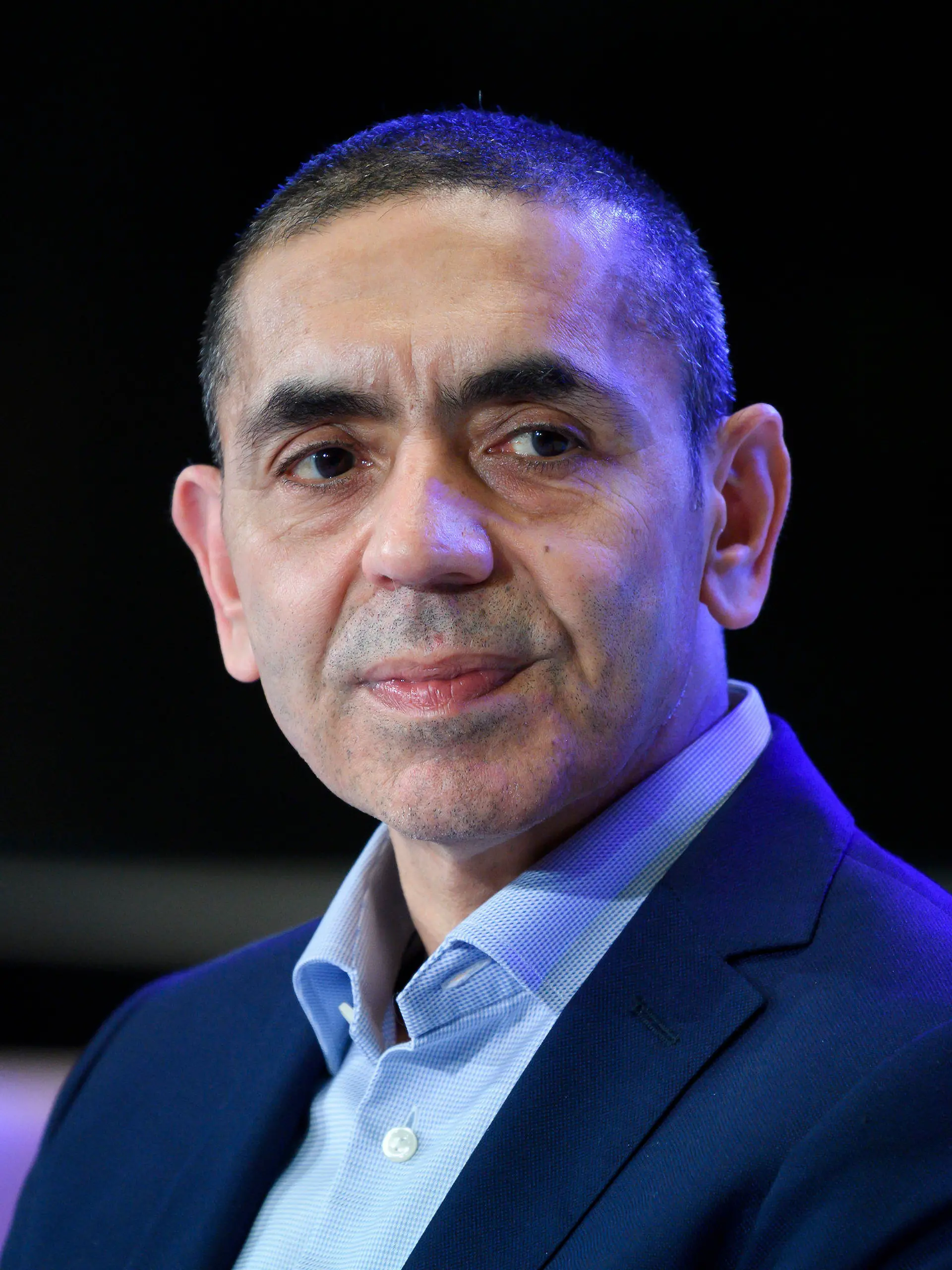 File - In this Thursday, March 18, 2021 file photo, Ugur Sahin, co-founder of the Mainz-based coronavirus vaccine developer BioNTech, listens during an Axel Springer Award ceremony. Europe can achieve 'herd immunity' against the coronavirus within the next four months, the head of German pharmaceutical company BioNTech, which developed the first widely approved COVID-19 vaccine with U.S. partner Pfizer, said Wednesday. (Bernd von Jutrczenka/dpa via AP, Pool, file)