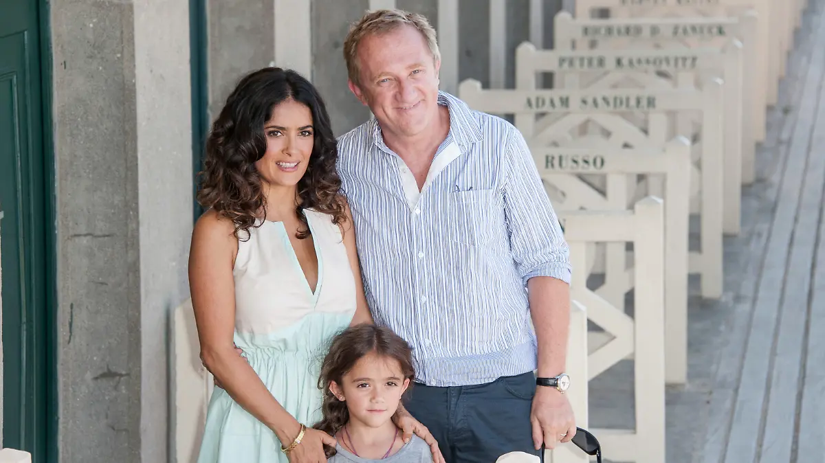 DEAUVILLE, FRANCE - SEPTEMBER 08: Salma Hayek poses her husband Francois-Henri Pinault with their daughter Valentina Paloma Pinault as she unveiled the beach locker room dedicated to her on the Promenade des Planches during the 38th Deauville American Film Festival on September 8, 2012 in Deauville, France. (Photo by Francois Durand/Getty Images)