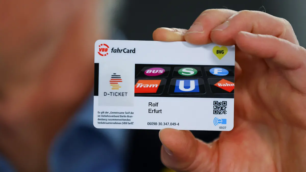 A person presents a discounted rail ticket that can be used throughout Germany, dubbed "Deutschland-Ticket", in Berlin, Germany May 1, 2023. REUTERS/Fabrizio Bensch