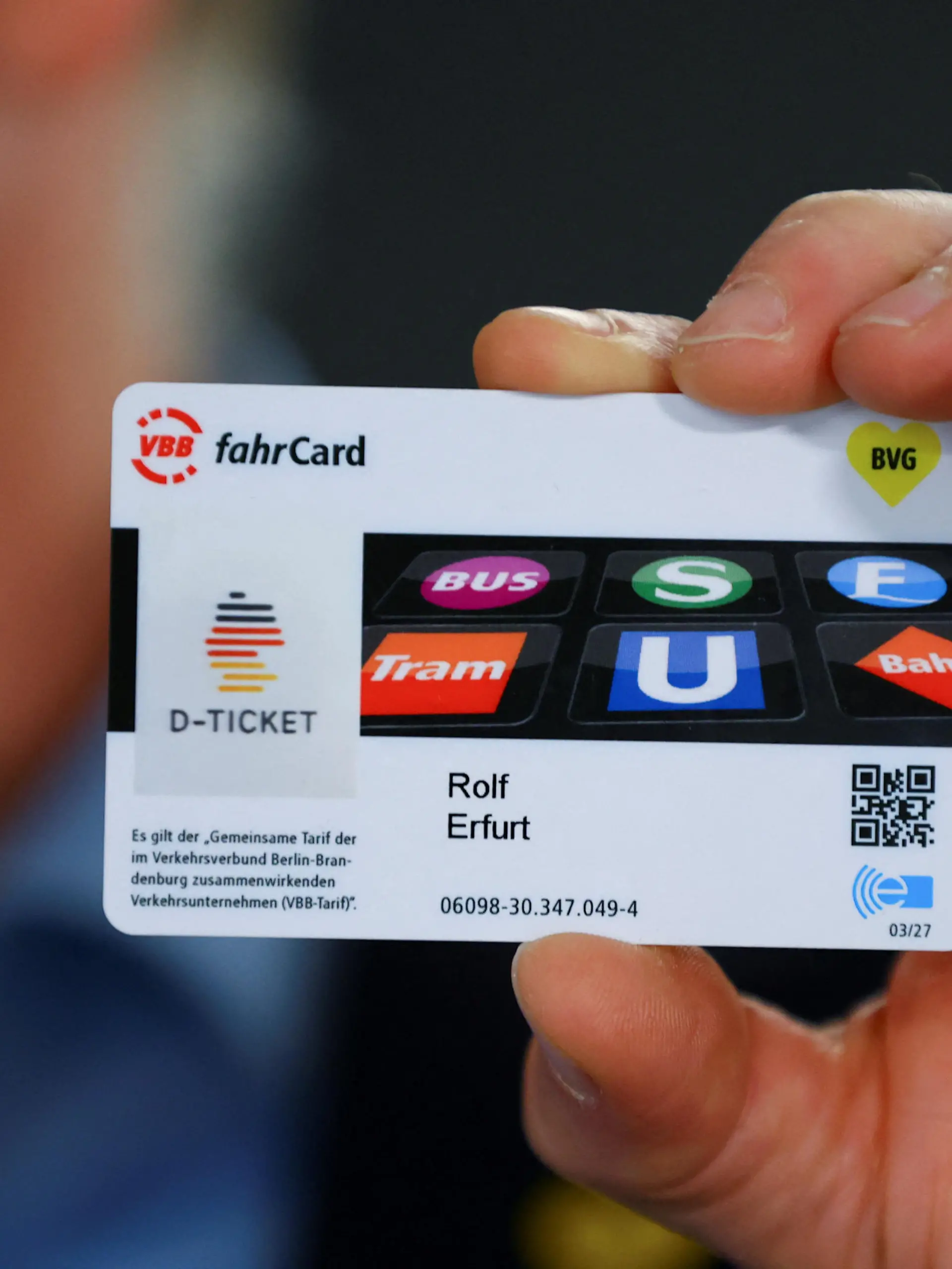 A person presents a discounted rail ticket that can be used throughout Germany, dubbed "Deutschland-Ticket", in Berlin, Germany May 1, 2023. REUTERS/Fabrizio Bensch