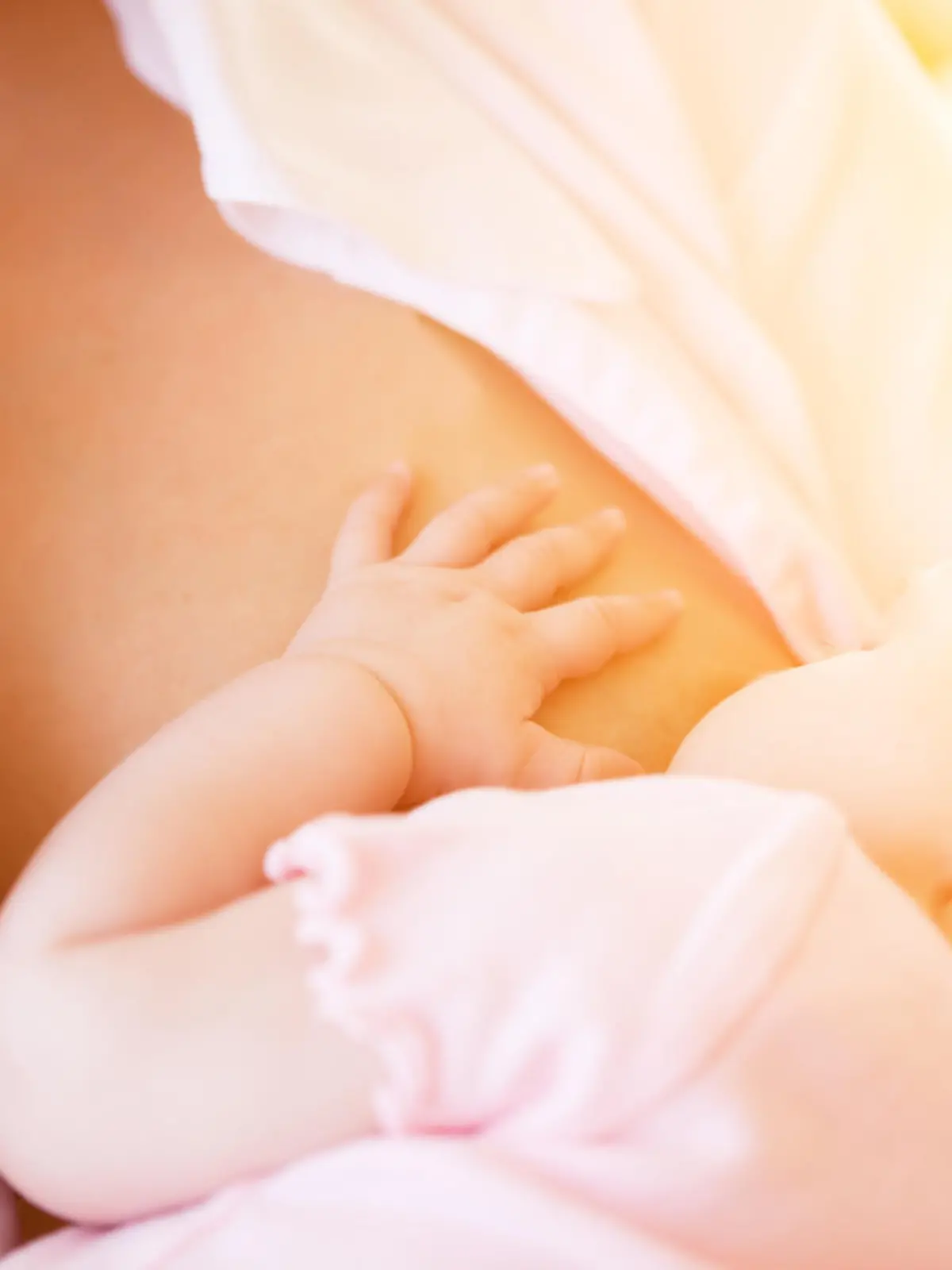 Mother nursing baby by breastfeeding