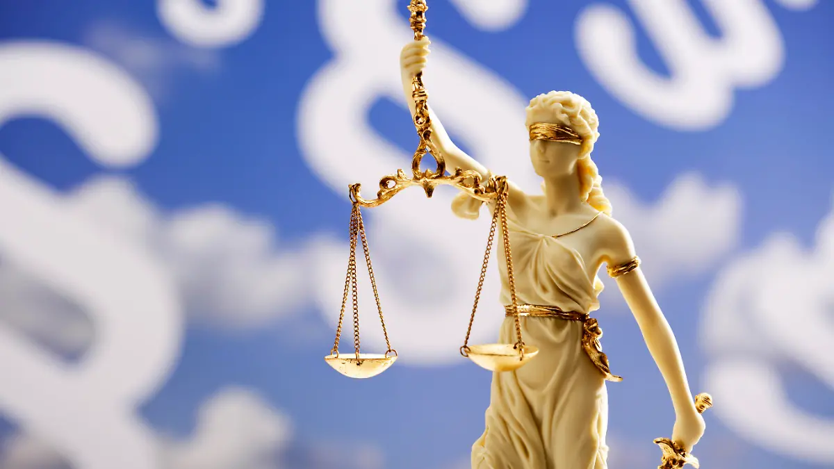 Figurine of justice holding scales