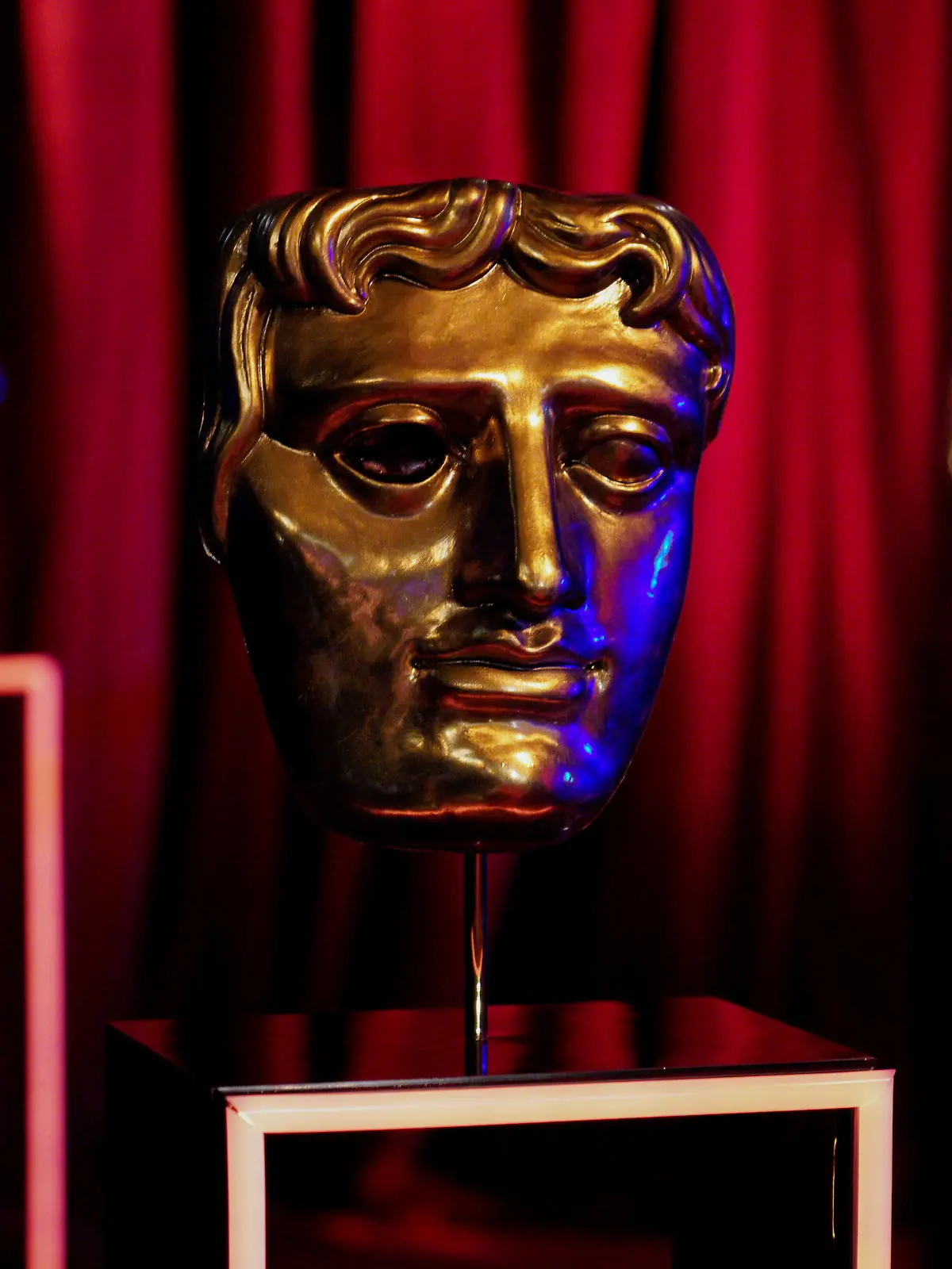 BAFTA award masks are seen on EE BAFTA Film Awards Opening Night during the 74th British Academy Film Awards at Royal Albert Hall in London, Britain, April 10, 2021.BAFTA/Scott Garfitt/Handout via REUTERS ATTENTION EDITORS - THIS IMAGE HAS BEEN SUPPLIED BY A THIRD PARTY. NO RESALES. NO ARCHIVES. MANDATORY CREDIT. FOR EDITORIAL USE ONLY IN REPORTING ON - 74TH BRITISH ACADEMY FILM AWARDS. IMAGE MUST BE USED IN ITS ENTIRETY - NO CROPPING OR OTHER MODIFICATIONS. NO NEW USE AFTER 2300GMT ON APRIL 18, 2021.