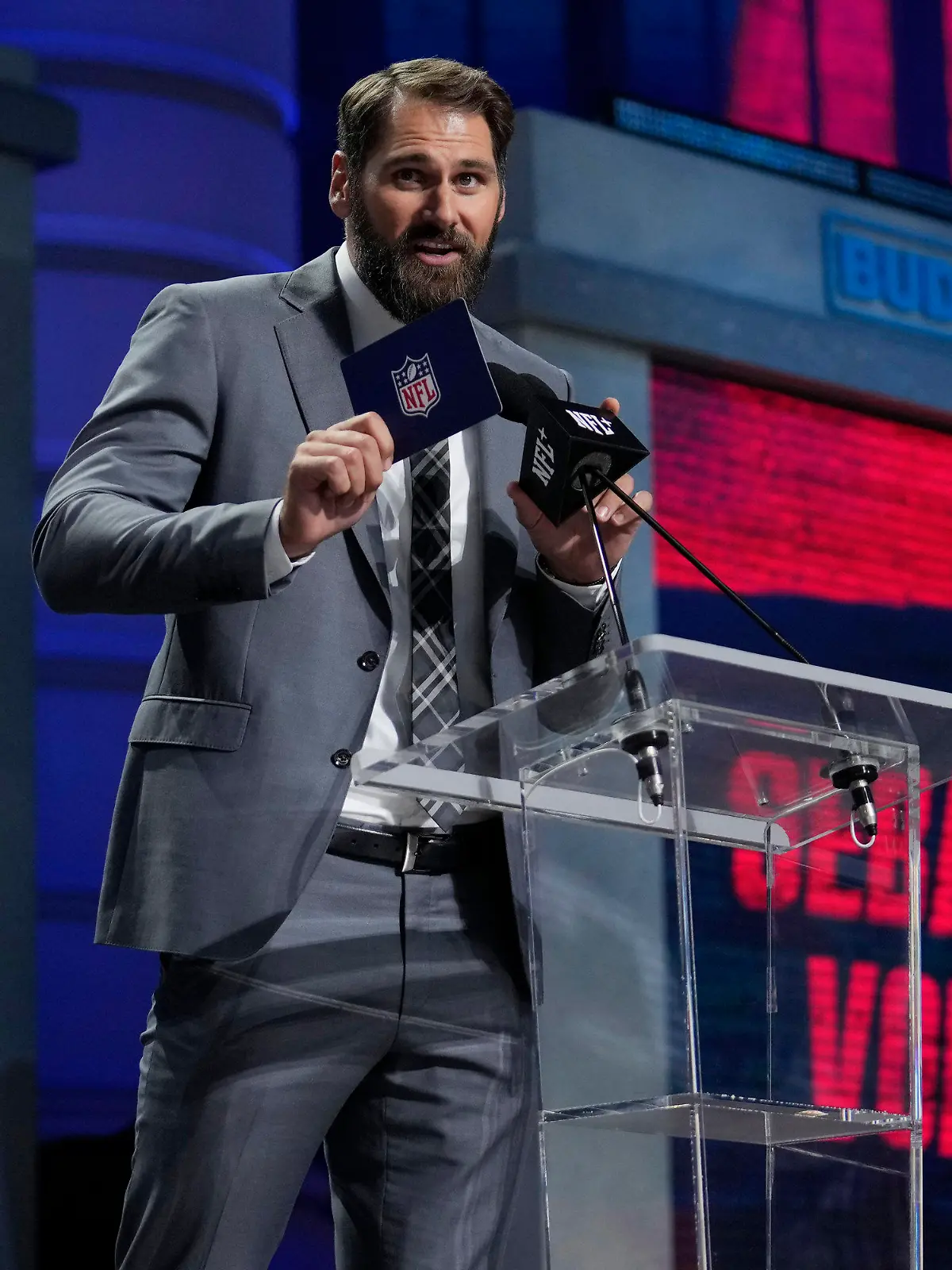Sebastian Vollmer announces Georgia Tech defensive lineman Keion White as the selection by the New England Patriots during the second round of the NFL football draft, Friday, April 28, 2023, in Kansas City, Mo. (AP Photo/Jeff Roberson)