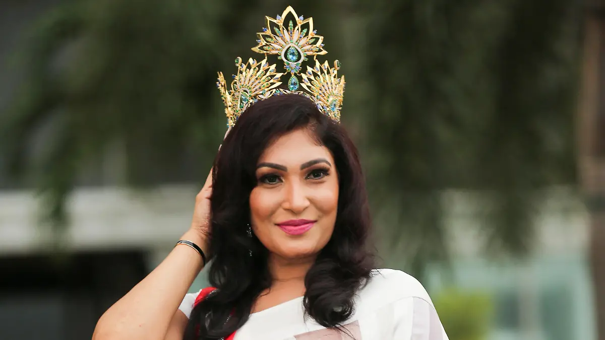 Pushpika De Silva poses for photographs with her Mrs Sri Lanka crown after it was forcibly removed by the reigning Mrs World, Caroline Jurie at the Mrs Sri Lanka contest, in Colombo, Sri Lanka, April 6, 2021. Picture taken April 6, 2021. REUTERS/Stringer